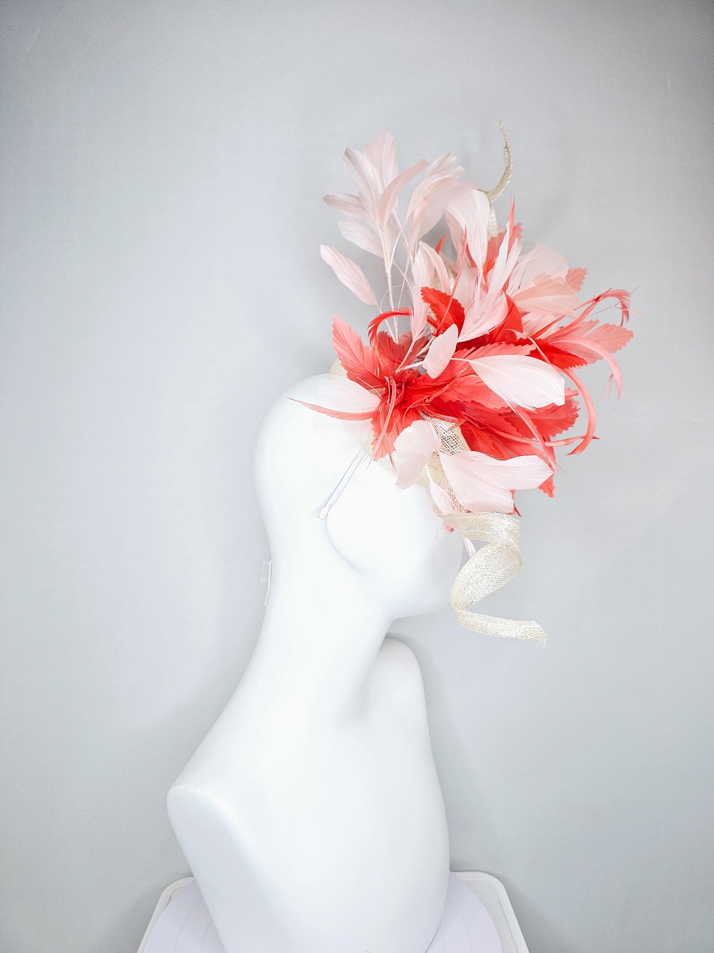 kentucky derby hat fascinator ivory white sinamay with curls,and coral feather flower with light pink branching feathers