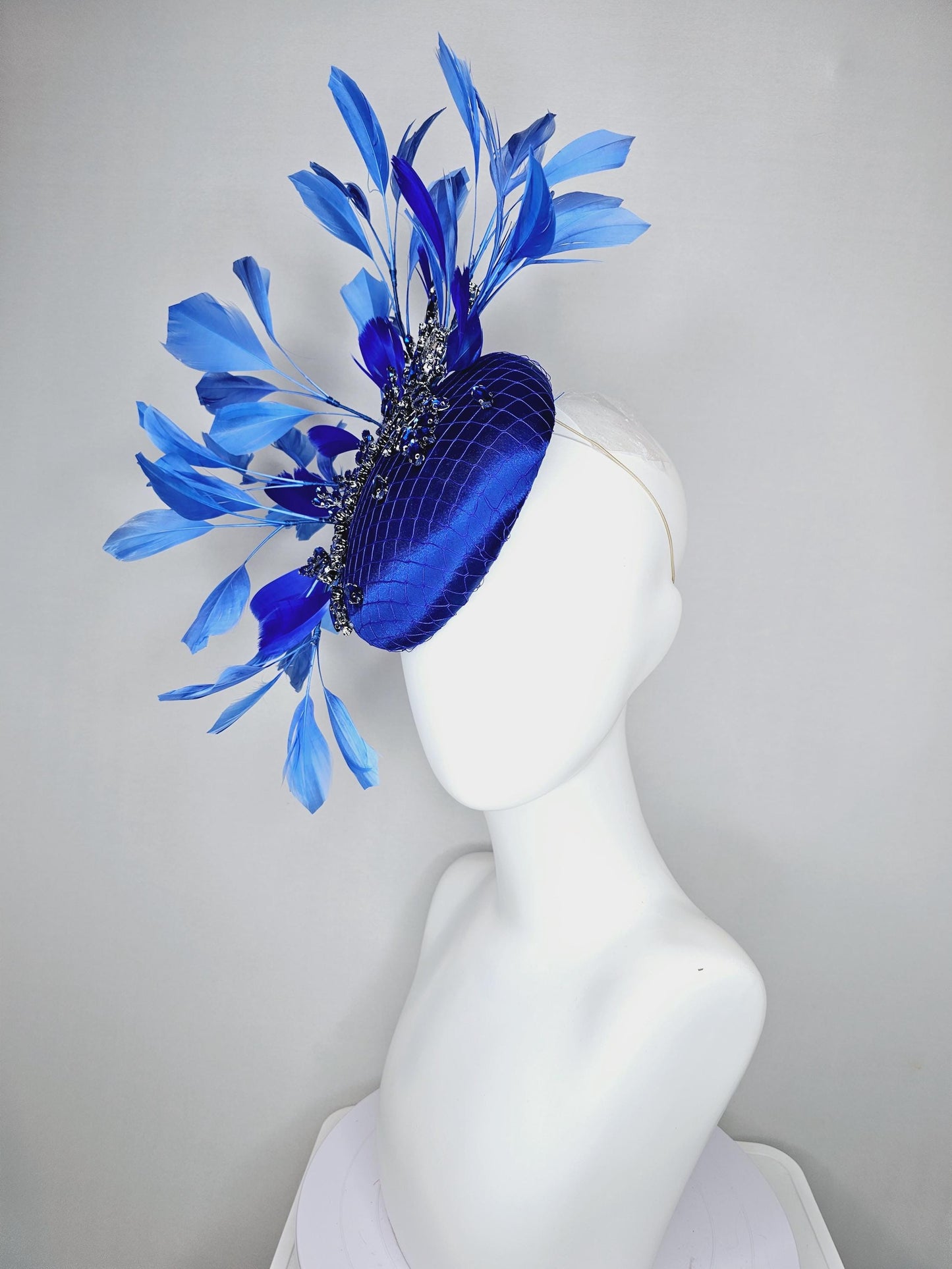 kentucky derby hat fascinator royal blue satin with netting and royal blue crystal beaded jewels stems, royal cobalt blue branching feathers