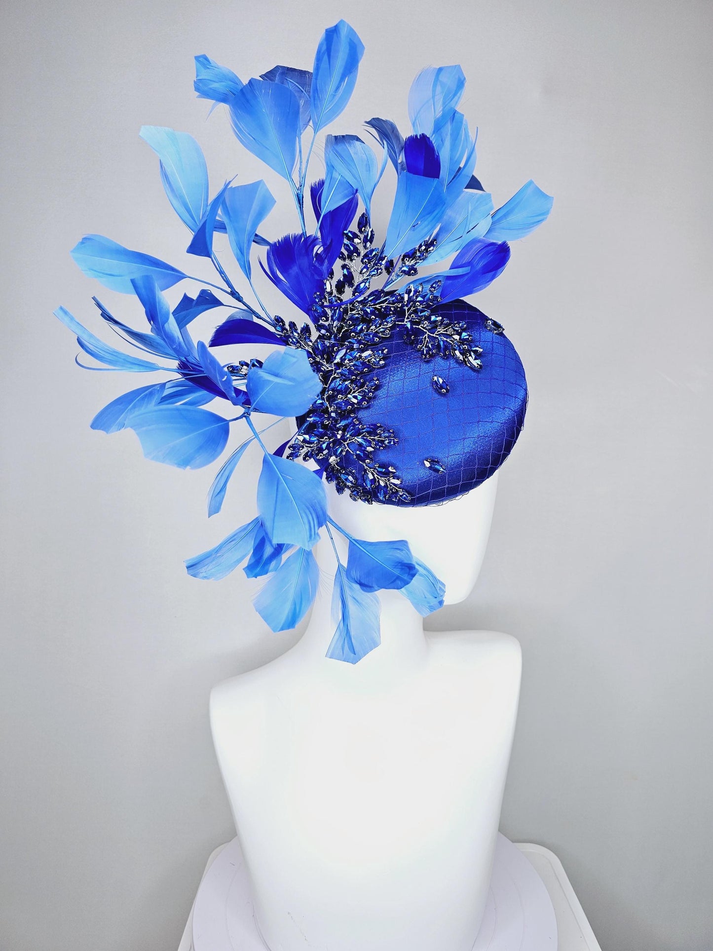 kentucky derby hat fascinator royal blue satin with netting and royal blue crystal beaded jewels stems, royal cobalt blue branching feathers