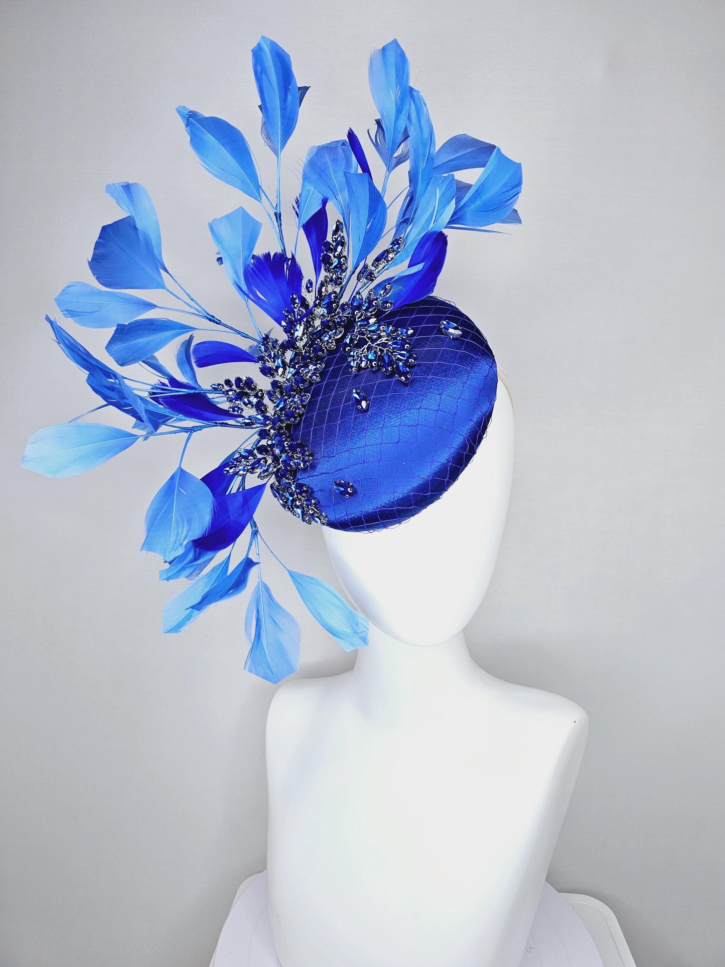 kentucky derby hat fascinator royal blue satin with netting and royal blue crystal beaded jewels stems, royal cobalt blue branching feathers