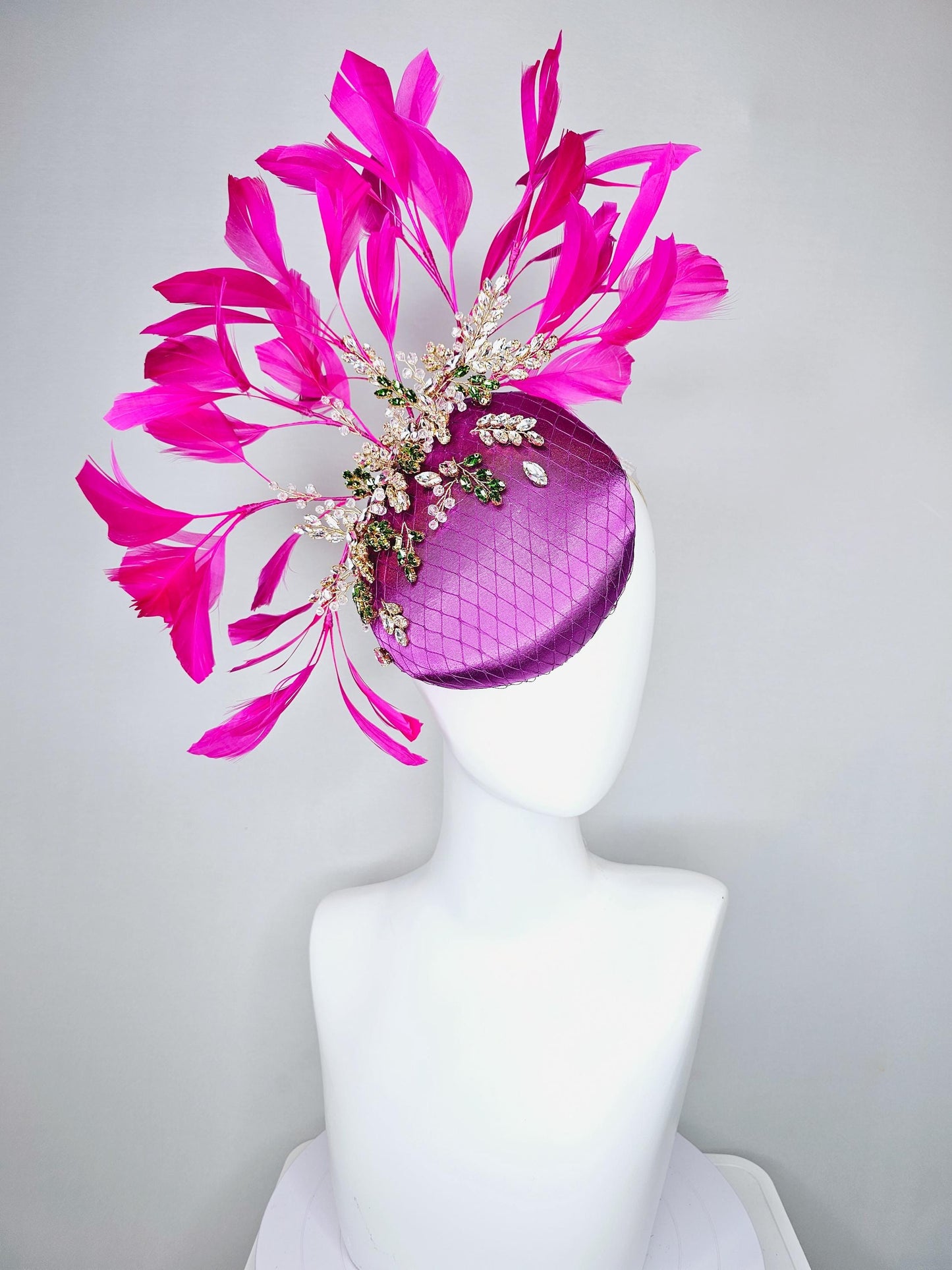 kentucky derby hat fascinator purple satin with netting,green and clear crystal beaded jewels stems,bright pink fuchsia branching feathers