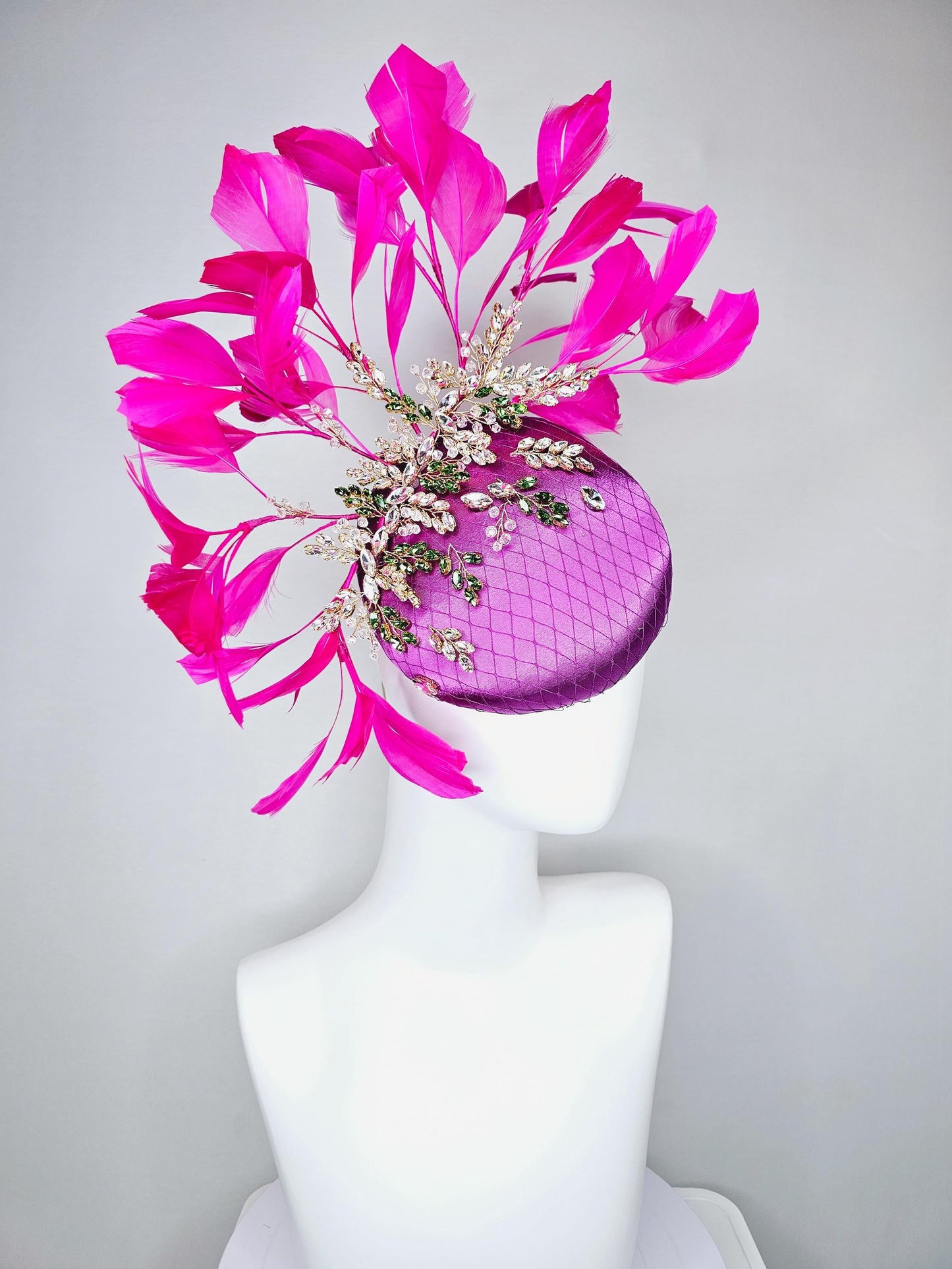 kentucky derby hat fascinator purple satin with netting,green and clear crystal beaded jewels stems,bright pink fuchsia branching feathers