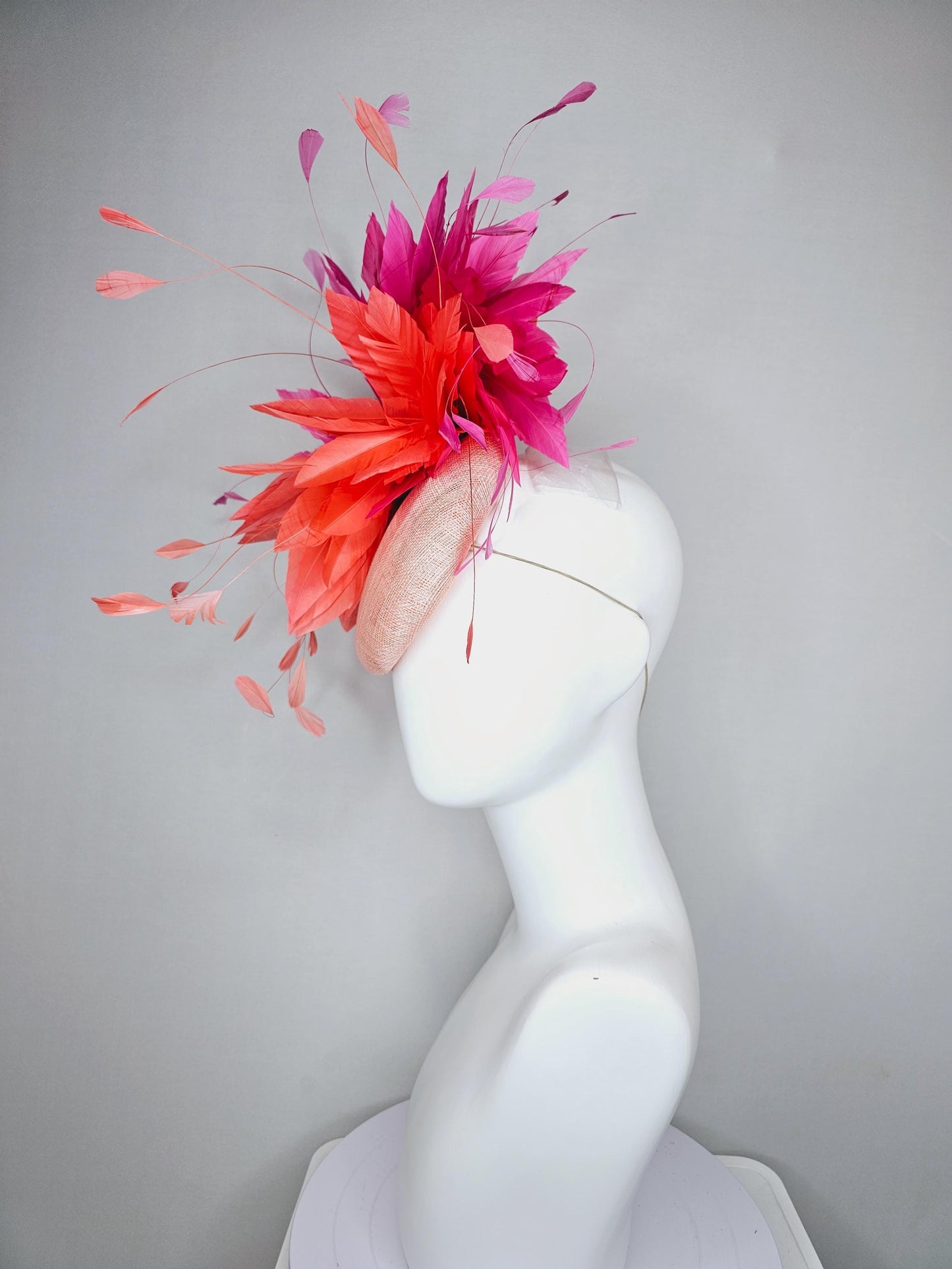 kentucky derby hat fascinator light orange peach sinamay with fluffy coral orange and hot pink branching feathers