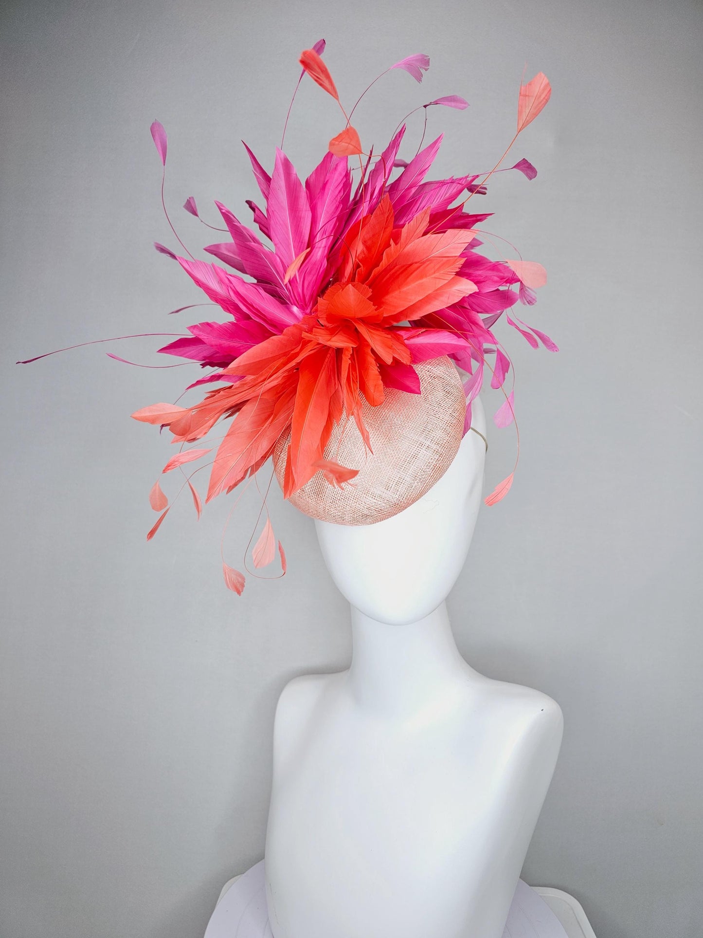 kentucky derby hat fascinator light orange peach sinamay with fluffy coral orange and hot pink branching feathers