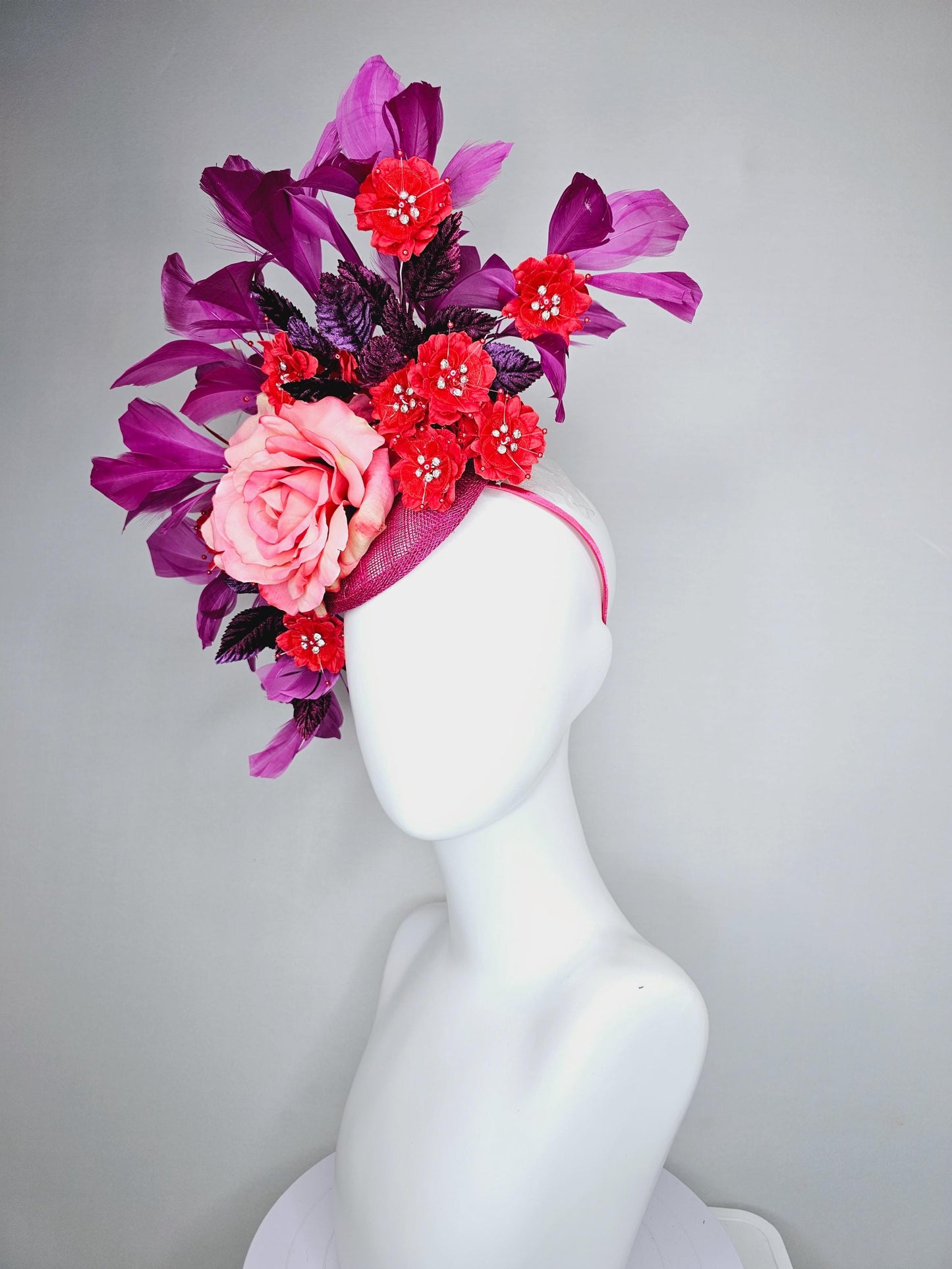 kentucky derby hat fascinator pink ombre satin rose, scarlet red satin flowers, purple leaves, magenta purple branching feathers