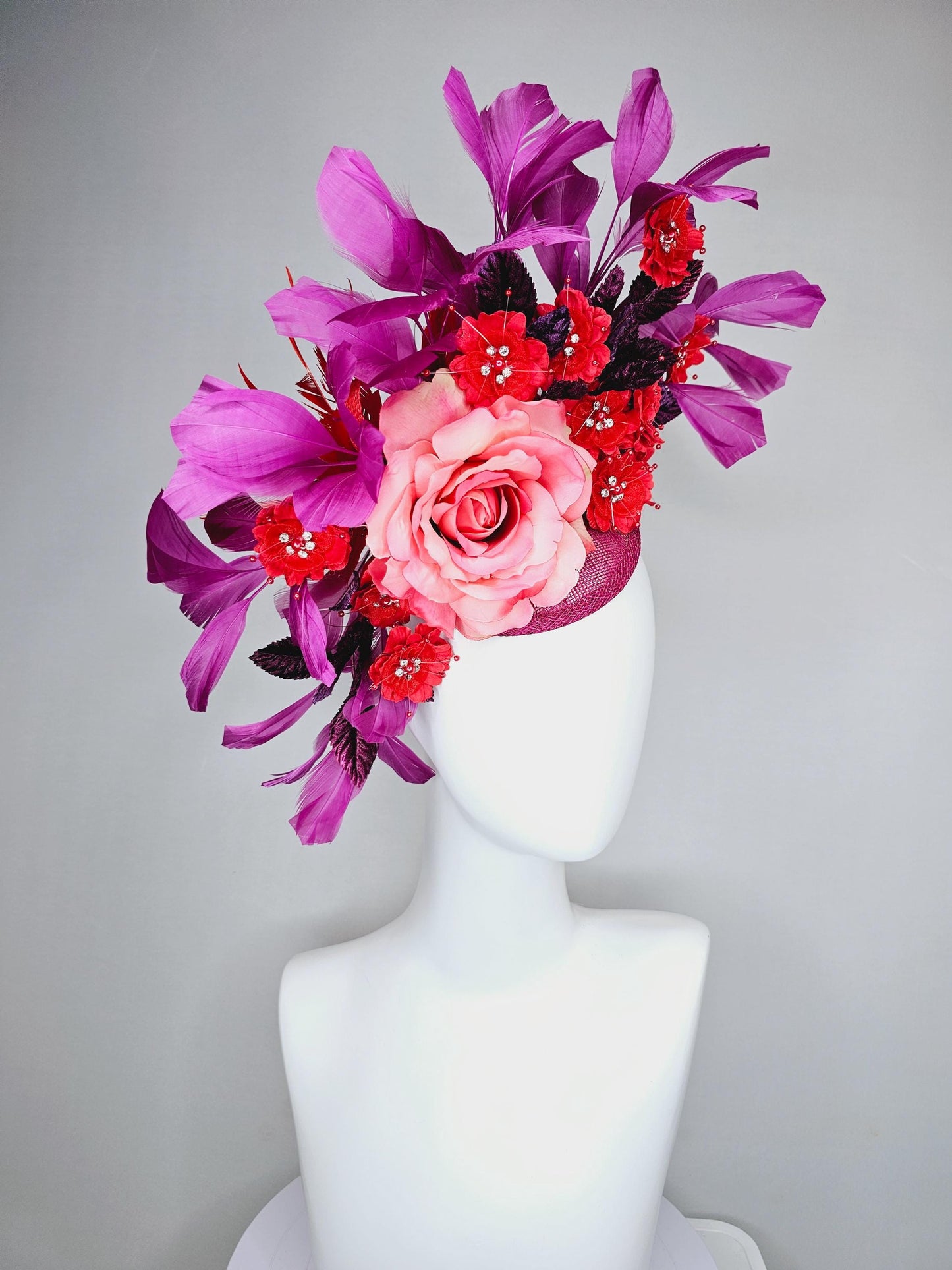 kentucky derby hat fascinator pink ombre satin rose, scarlet red satin flowers, purple leaves, magenta purple branching feathers