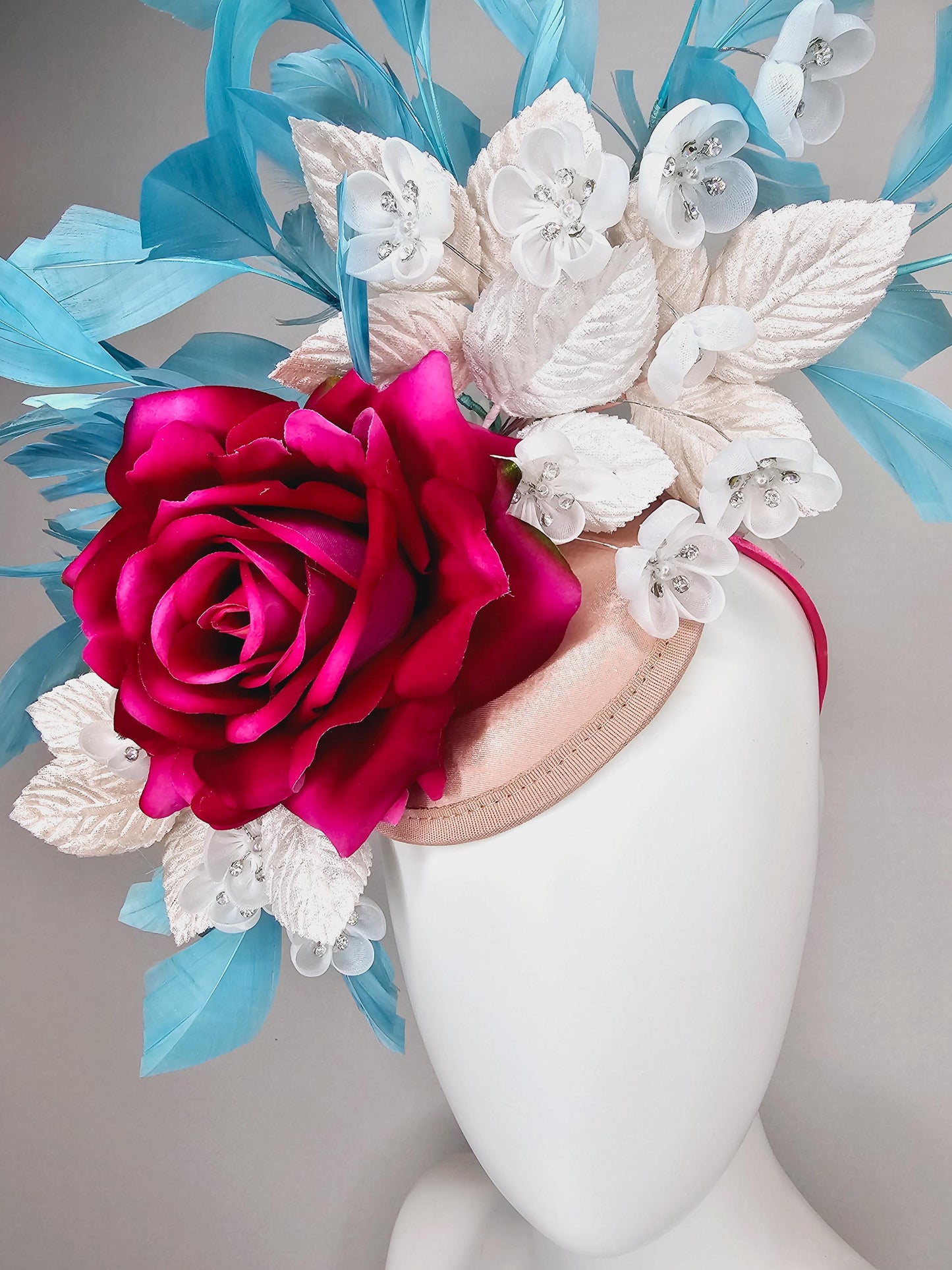 kentucky derby hat fascinator ombre fuchsia pink satin rose,white flowers with crystal pearl center,white leaves,sky blue branching feathers