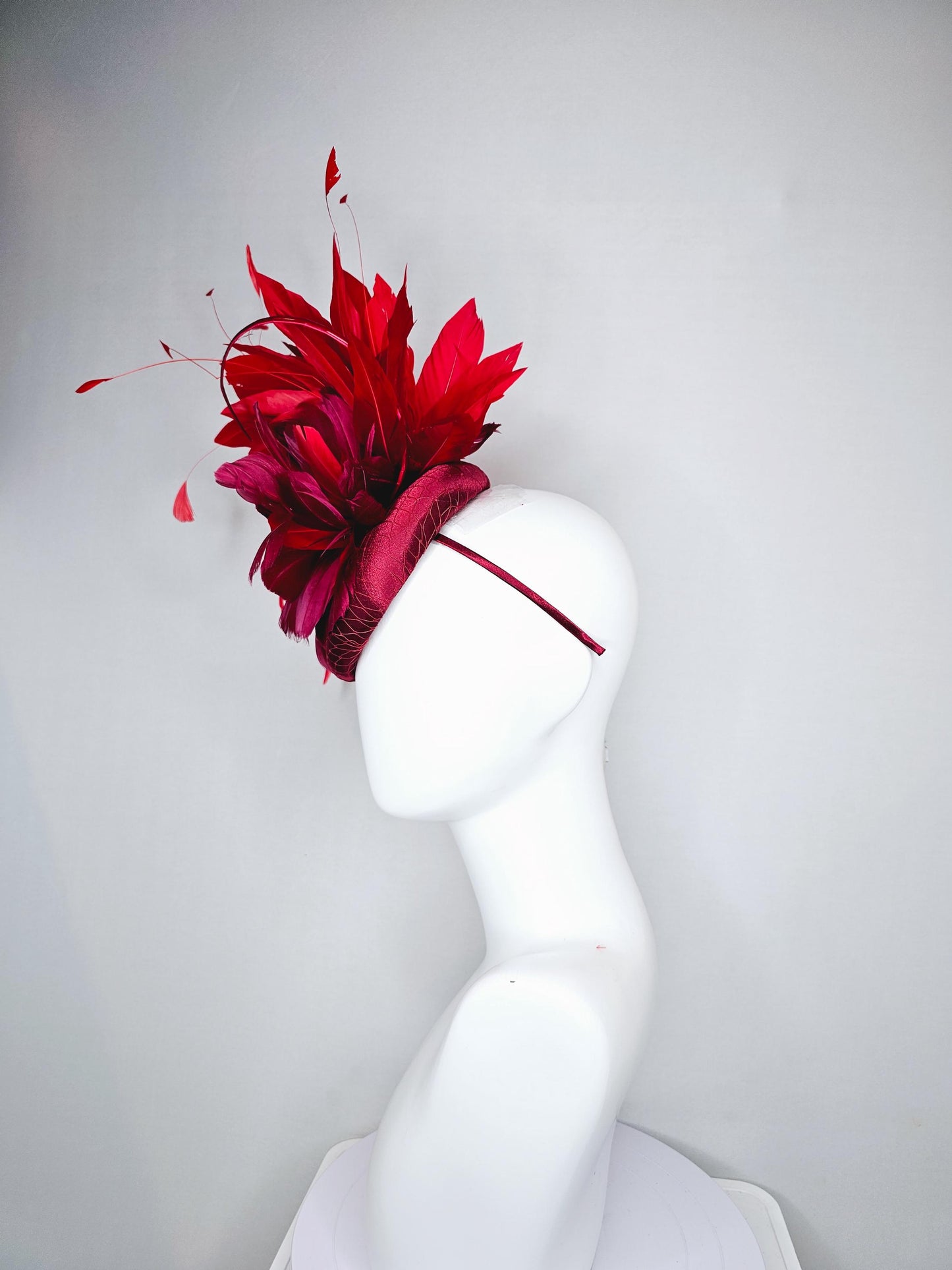 kentucky derby hat fascinator wine red burgundy satin with netting and branching bright scarlet red feathers and burgundy branching feathers