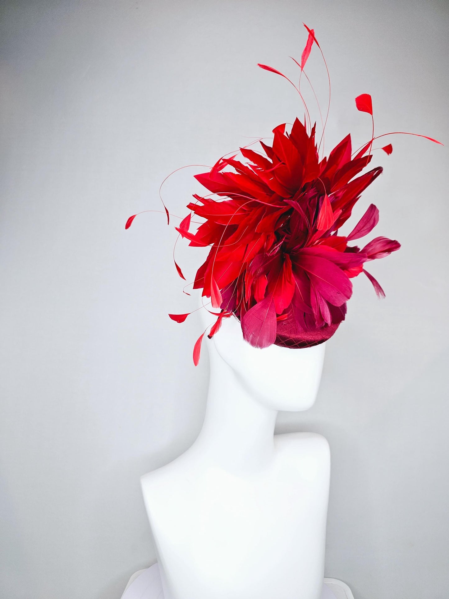 kentucky derby hat fascinator wine red burgundy satin with netting and branching bright scarlet red feathers and burgundy branching feathers