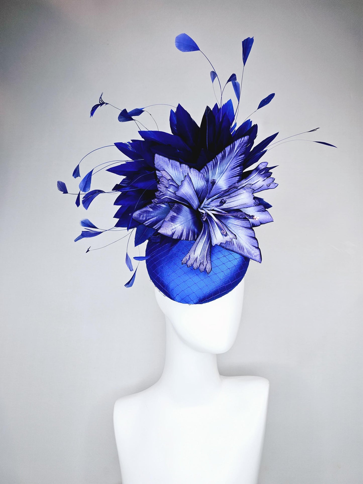 kentucky derby hat fascinator royal blue satin with netting,large ombre light blue satin flower, and midnight navy blue branching feathers