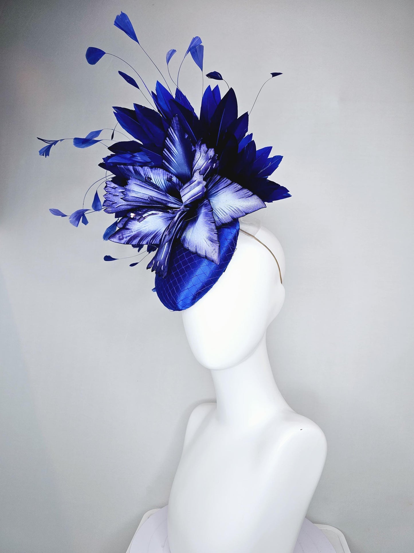 kentucky derby hat fascinator royal blue satin with netting,large ombre light blue satin flower, and midnight navy blue branching feathers