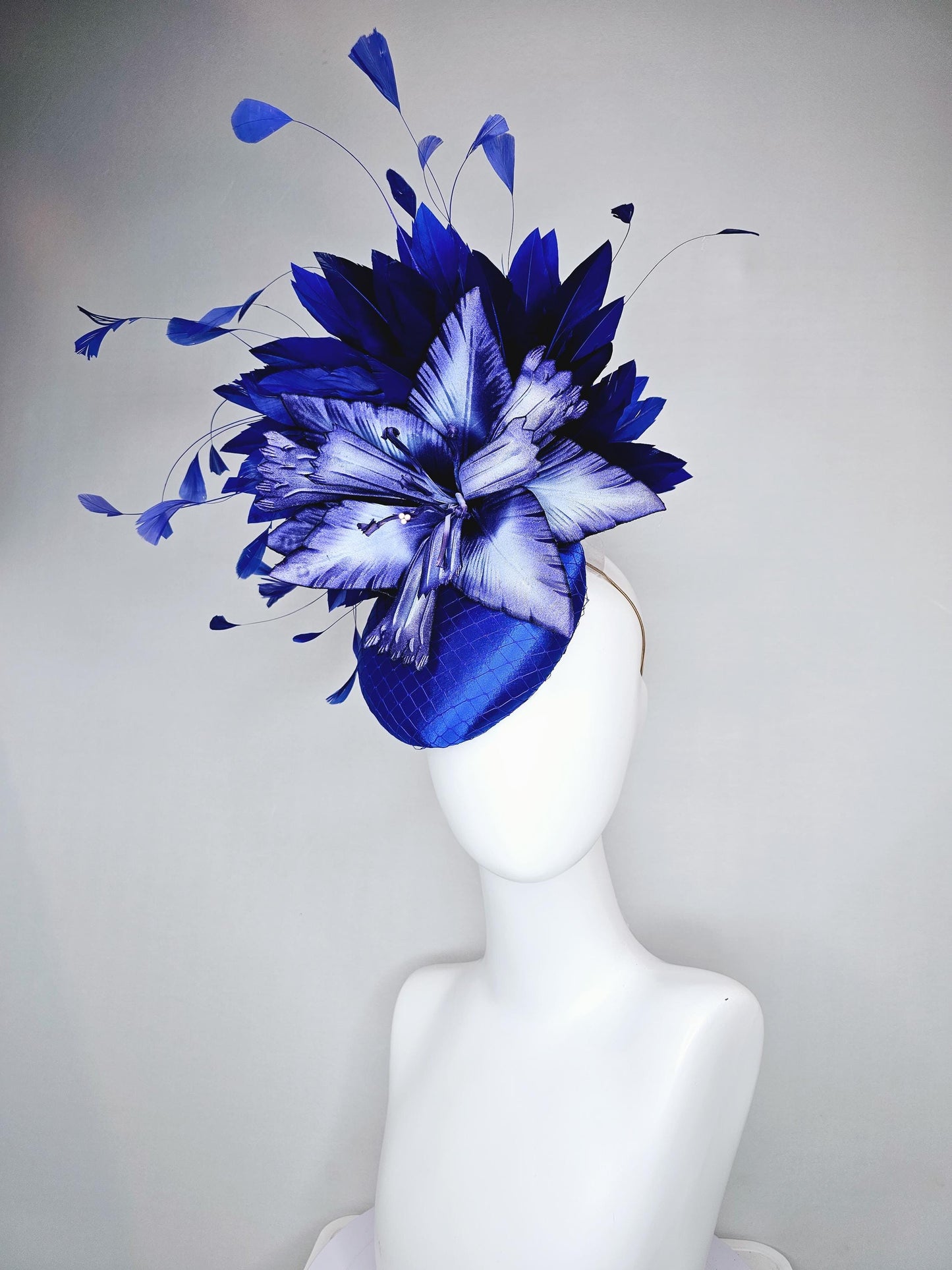 kentucky derby hat fascinator royal blue satin with netting,large ombre light blue satin flower, and midnight navy blue branching feathers