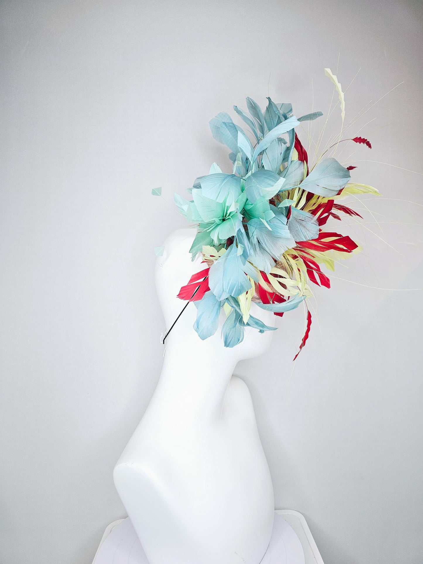 kentucky derby hat fascinator champagne satin with netting with colorful yellow, bright red, and teal blue branching feathers