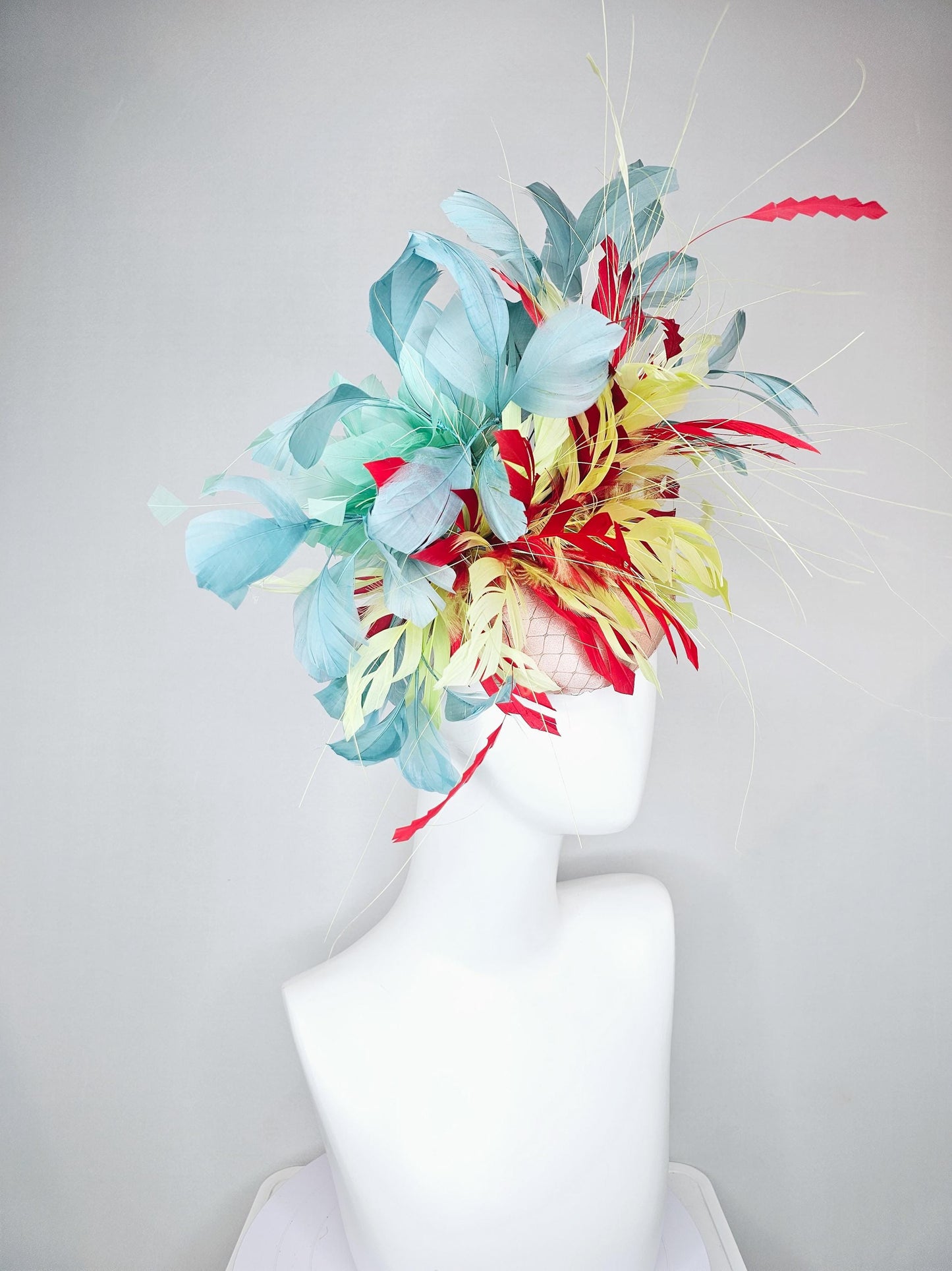 kentucky derby hat fascinator champagne satin with netting with colorful yellow, bright red, and teal blue branching feathers