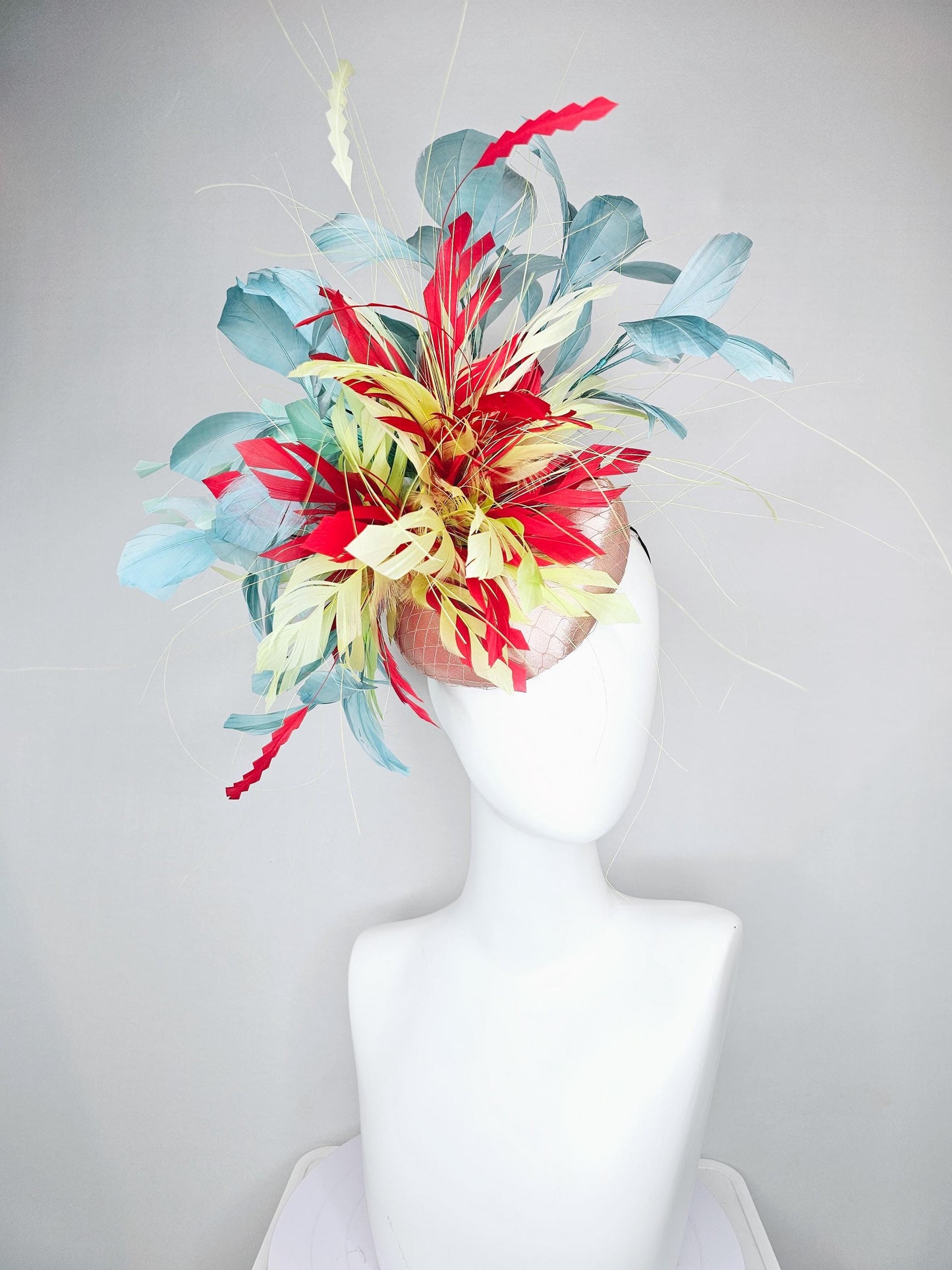 kentucky derby hat fascinator champagne satin with netting with colorful yellow, bright red, and teal blue branching feathers