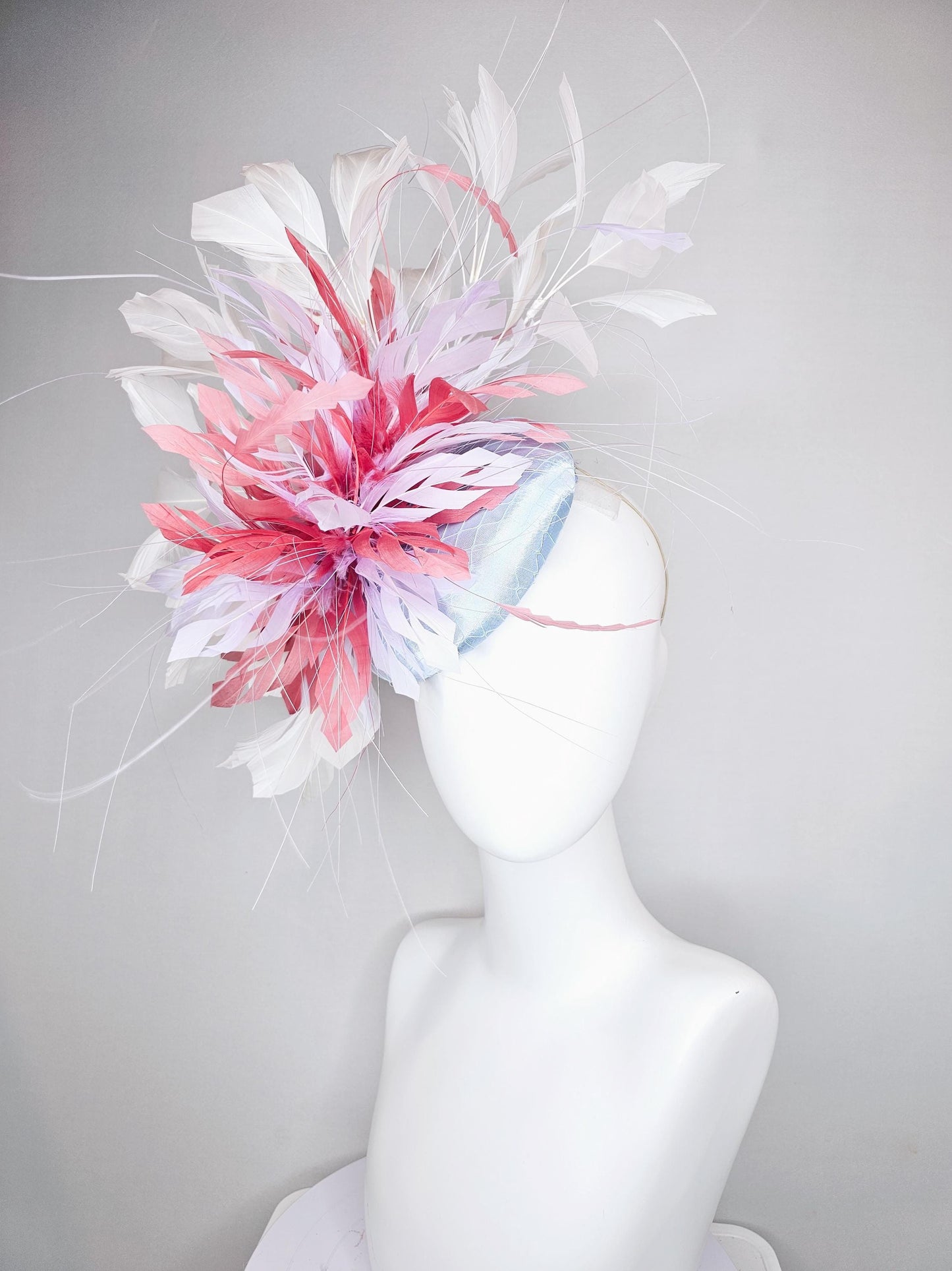 kentucky derby hat fascinator light baby blue satin with netting with blush pink,white,and light purple branching feathers