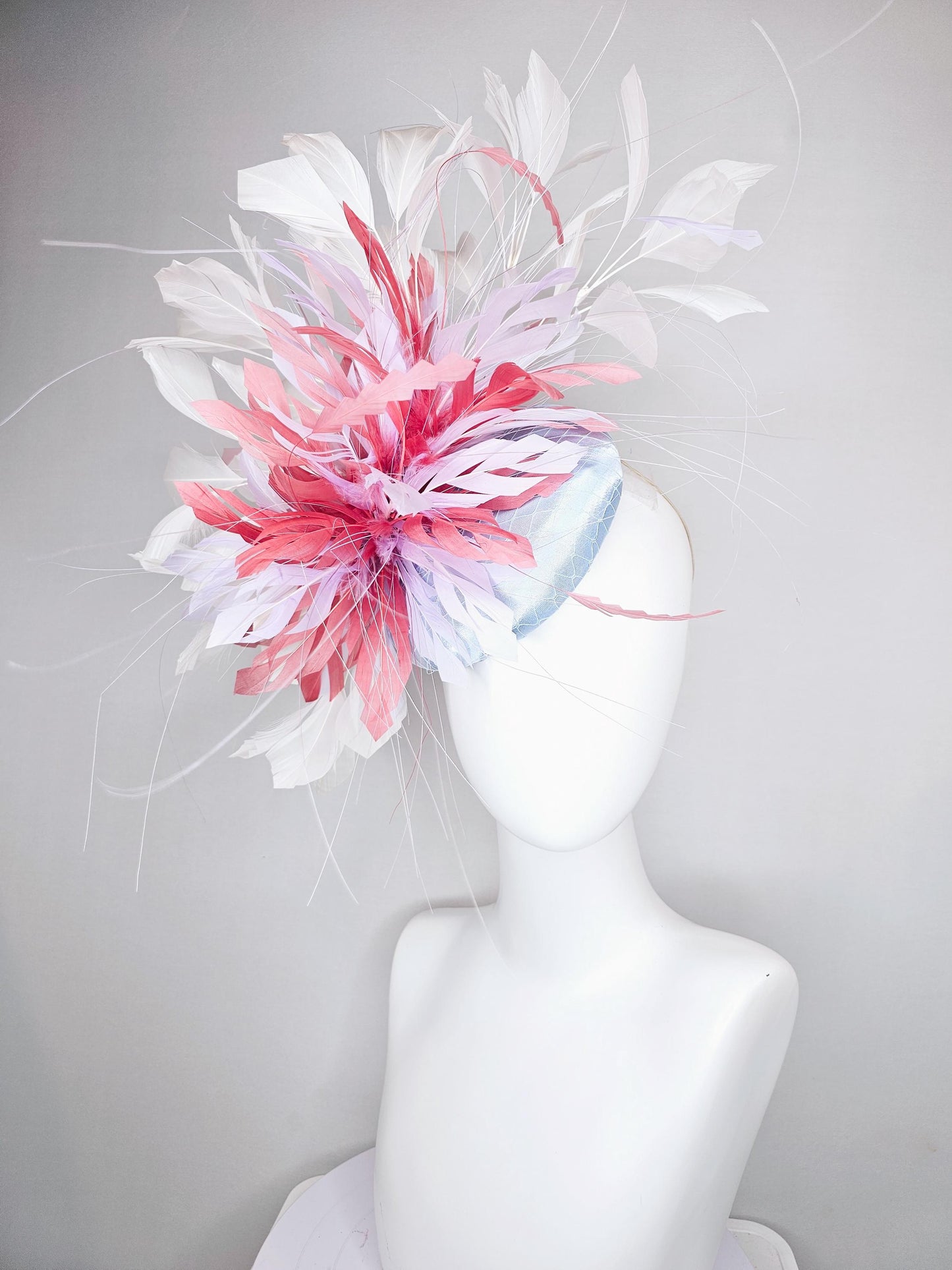 kentucky derby hat fascinator light baby blue satin with netting with blush pink,white,and light purple branching feathers