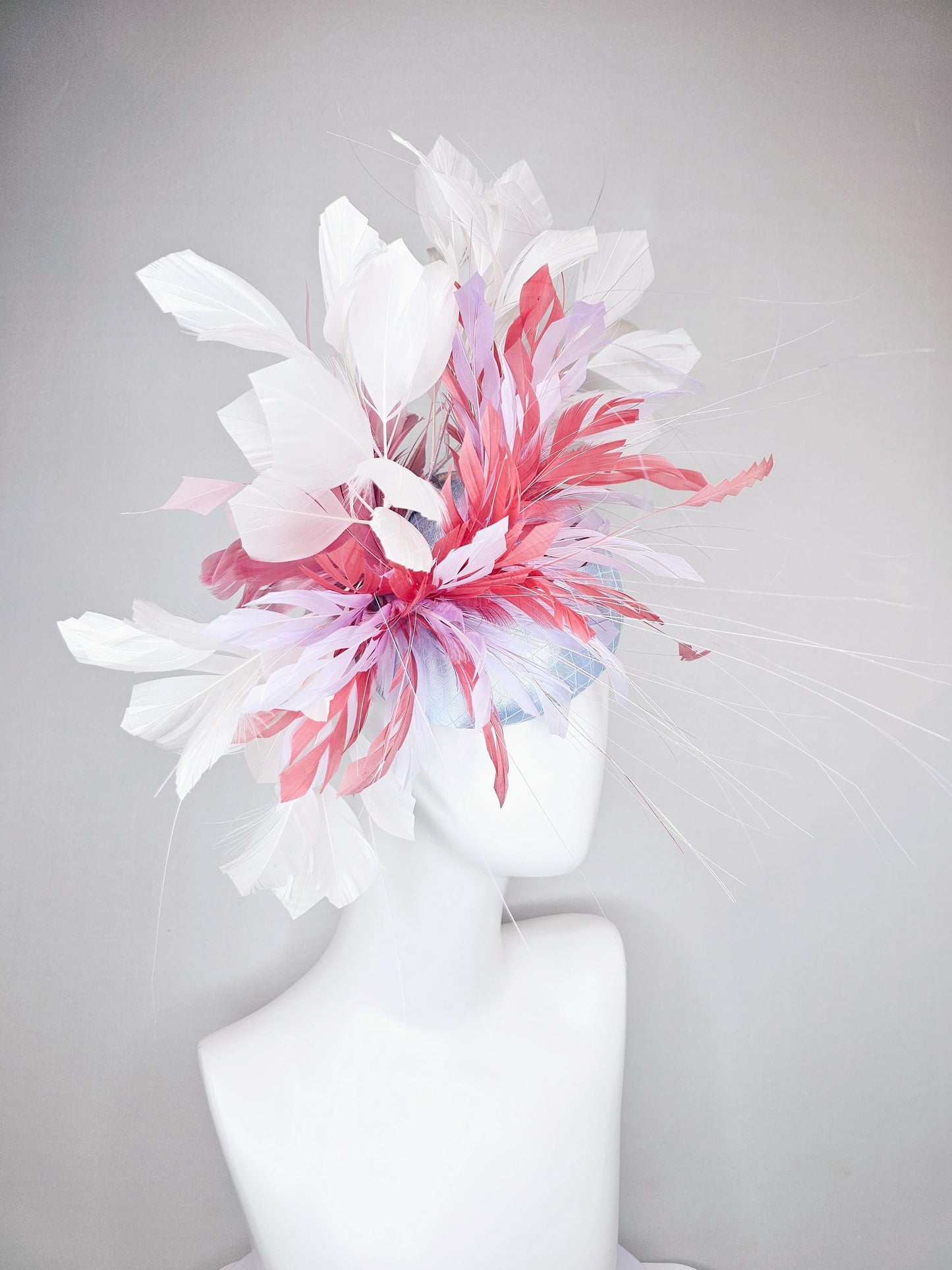 kentucky derby hat fascinator light baby blue satin with netting with blush pink,white,and light purple branching feathers