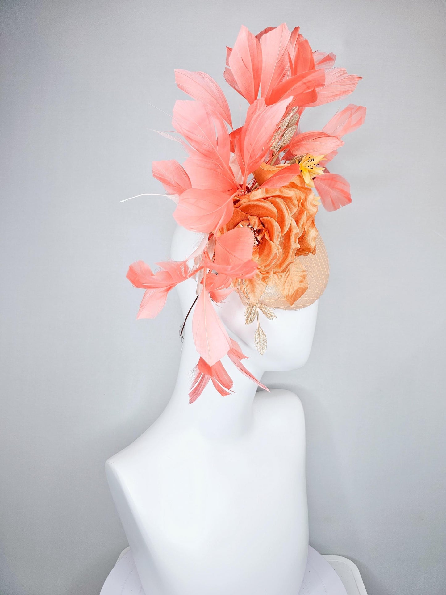 kentucky derby hat fascinator champagne satin with netting,orange satin flowers,yellow floral stems,coral orange feathers and gold leaves