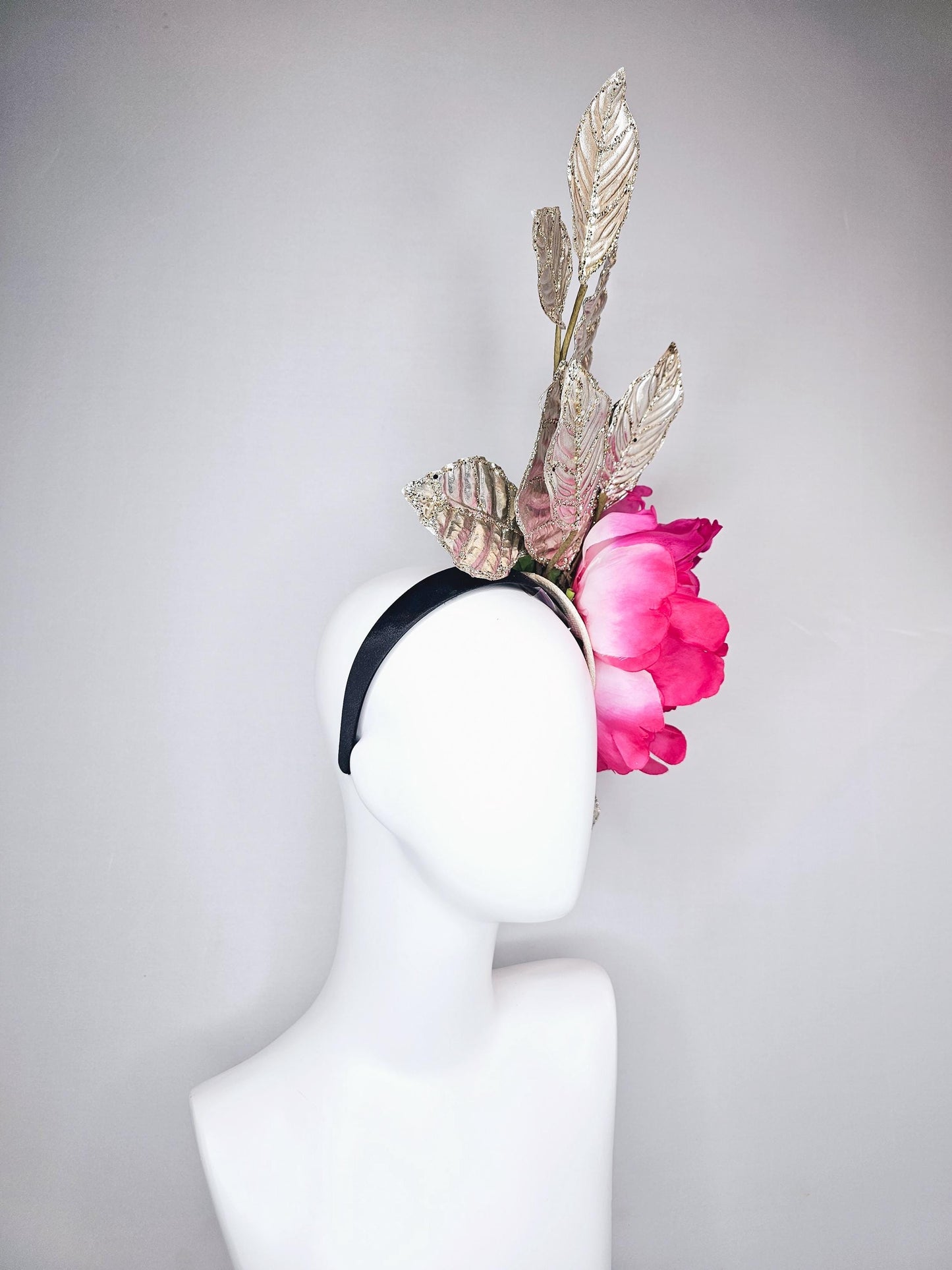 kentucky derby hat fascinator large ombre pink satin silk flower with gold sparkle glitter branching leaves on a black satin headband