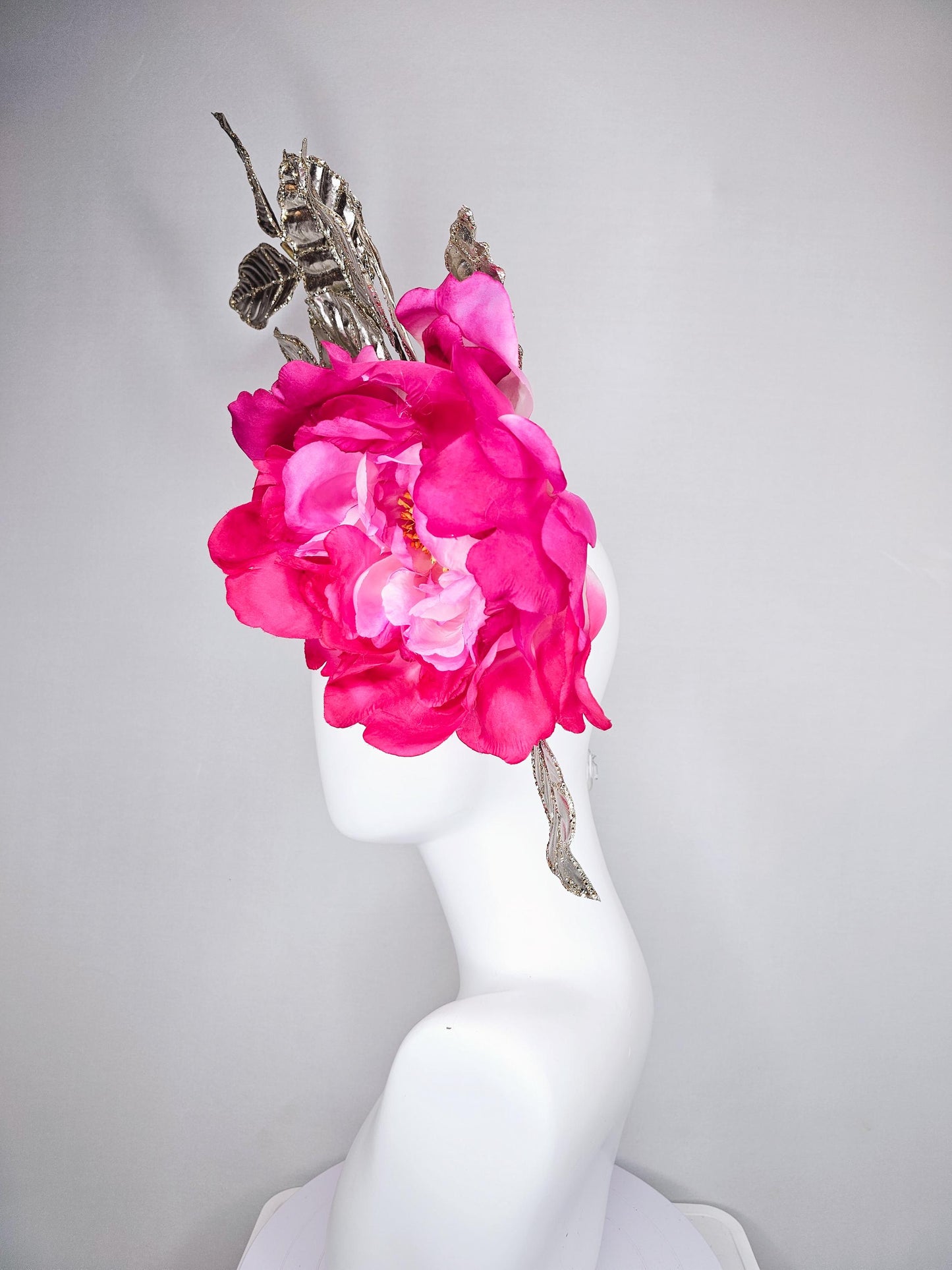 kentucky derby hat fascinator large ombre pink satin silk flower with gold sparkle glitter branching leaves on a black satin headband