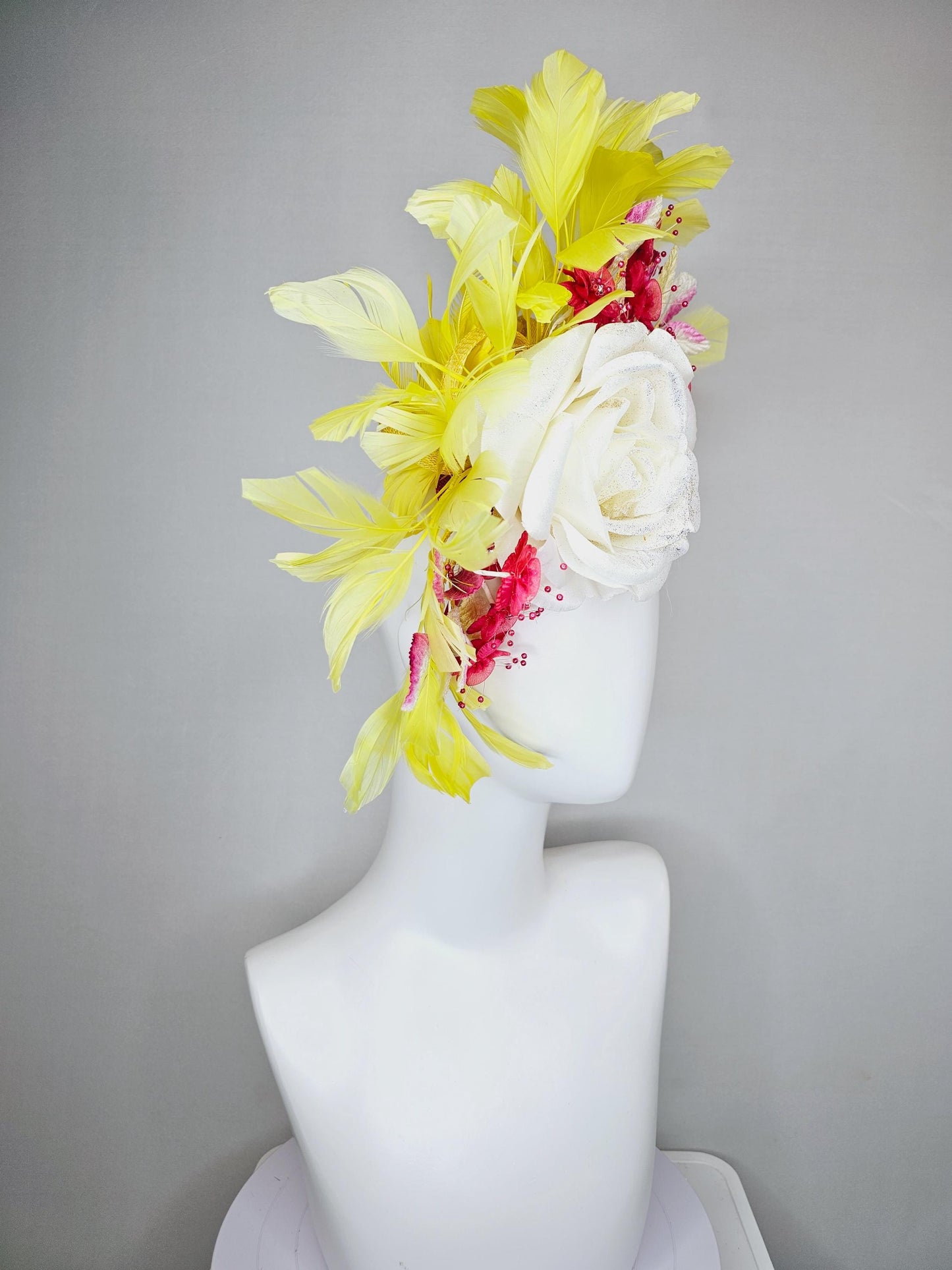 kentucky derby hat fascinator ivory white satin rose,hot pink satin flowers with pearls, yellow pink ombre leaves, yellow branching feathers