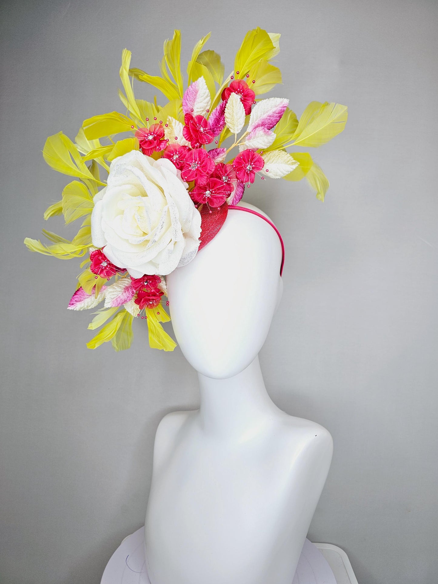 kentucky derby hat fascinator ivory white satin rose,hot pink satin flowers with pearls, yellow pink ombre leaves, yellow branching feathers