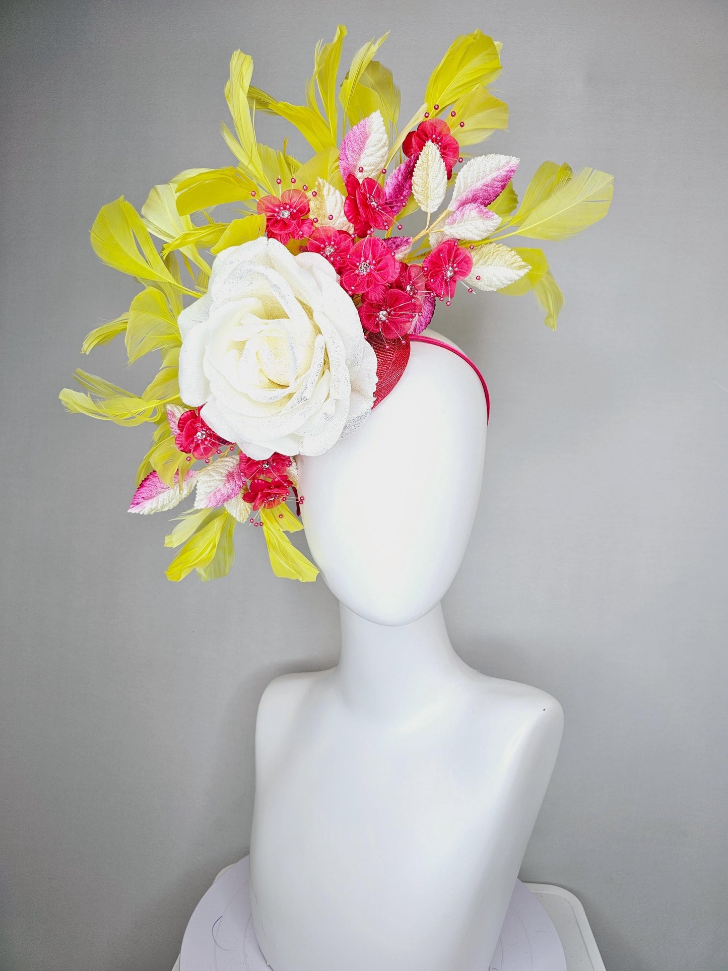 kentucky derby hat fascinator ivory white satin rose,hot pink satin flowers with pearls, yellow pink ombre leaves, yellow branching feathers