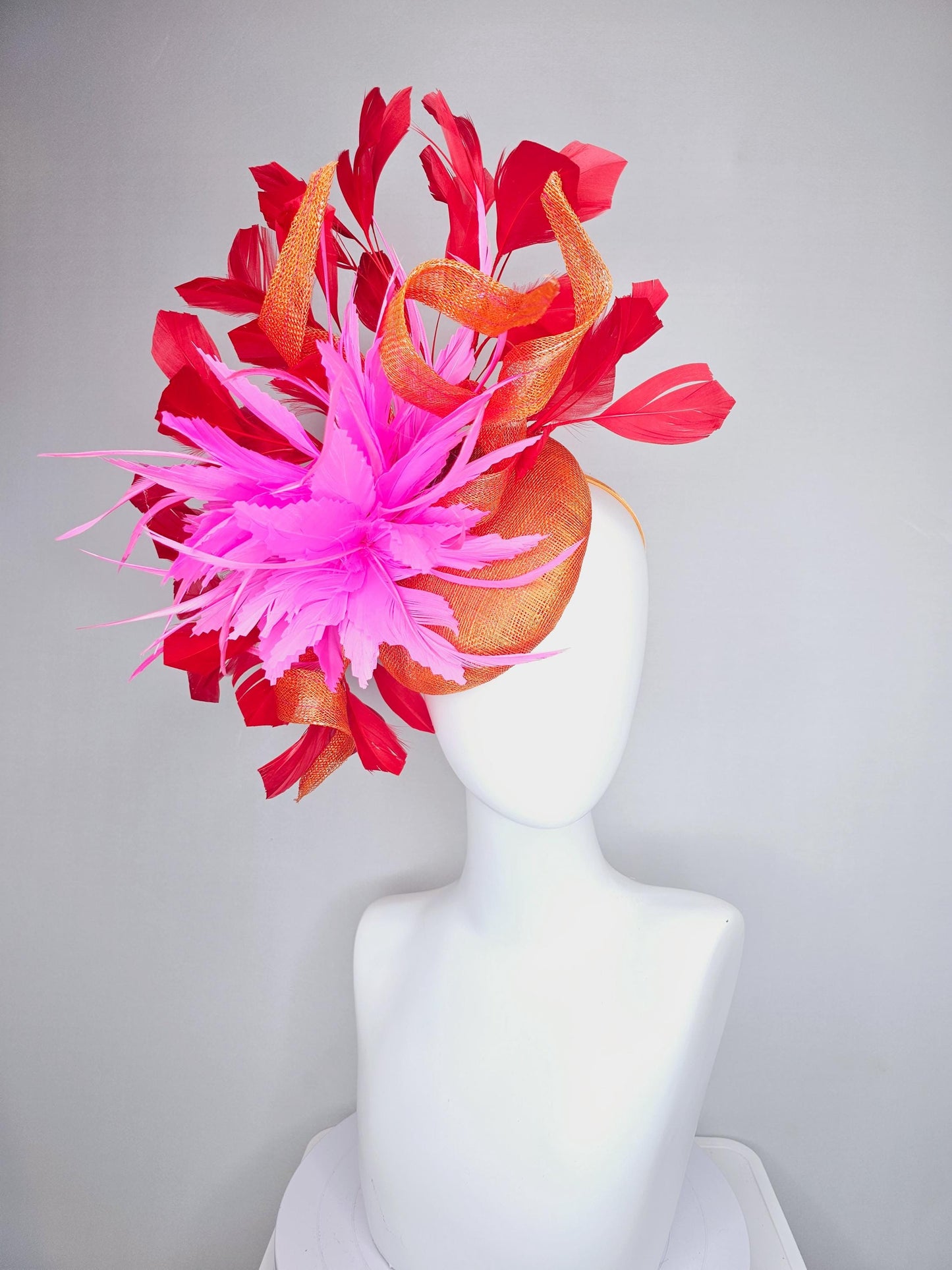 kentucky derby hat fascinator orange sinamay with curls and fluffy zigzag bright pink feather flower, red branching feathers