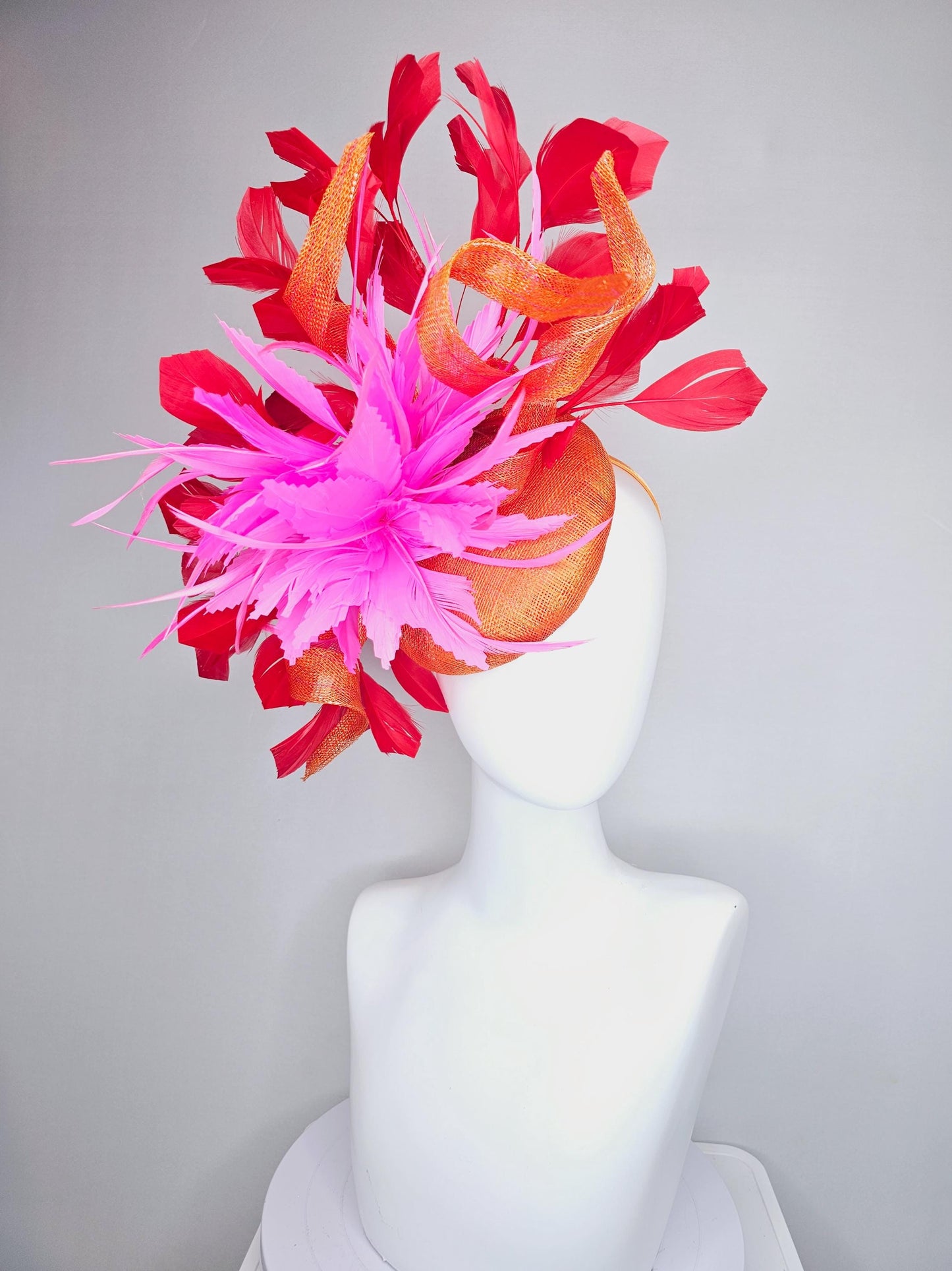 kentucky derby hat fascinator orange sinamay with curls and fluffy zigzag bright pink feather flower, red branching feathers