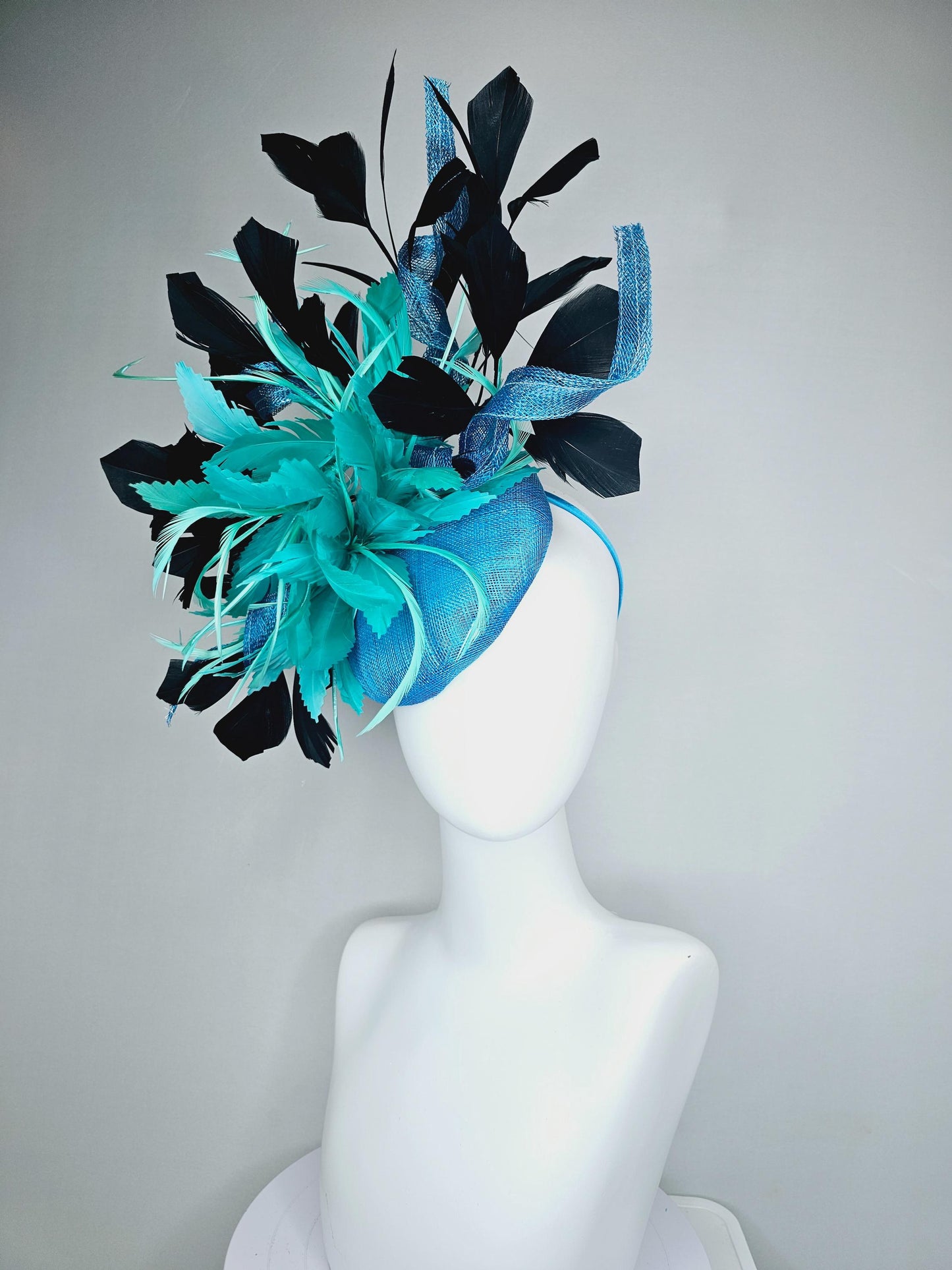 kentucky derby hat fascinator sky blue sinamay with curls, fluffy zigzag turquoise blue mint green feather flower, black branching feathers