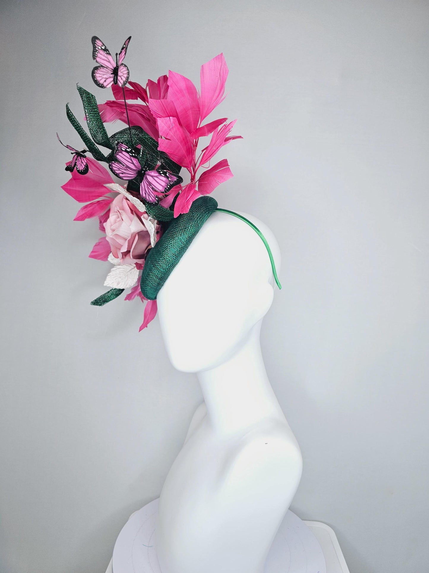 kentucky derby hat fascinator dark green sinamay w/ curls, pink ombre satin rose,white leaves,pink branching feathers,pink black butterflies