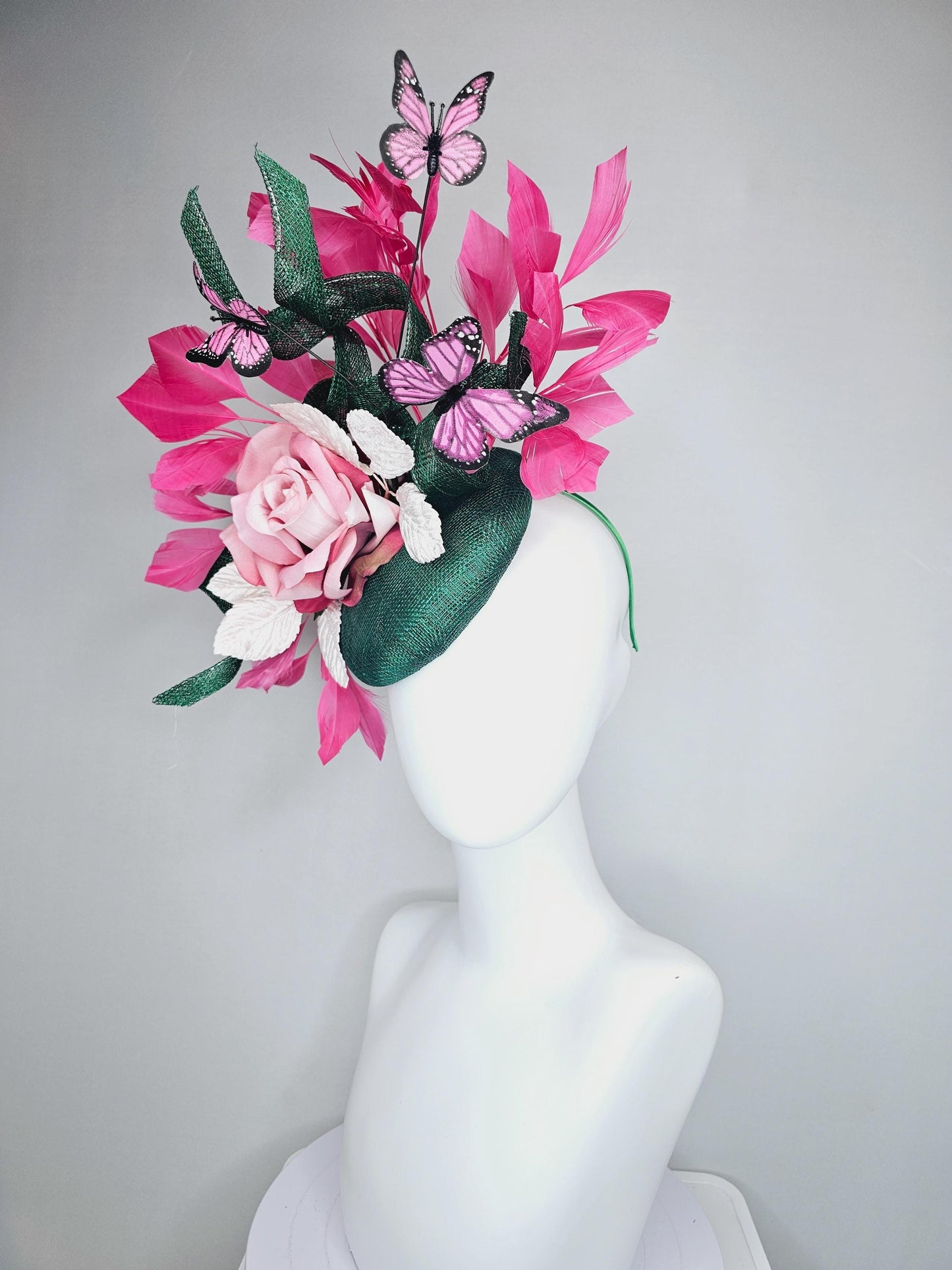 kentucky derby hat fascinator dark green sinamay w/ curls, pink ombre satin rose,white leaves,pink branching feathers,pink black butterflies