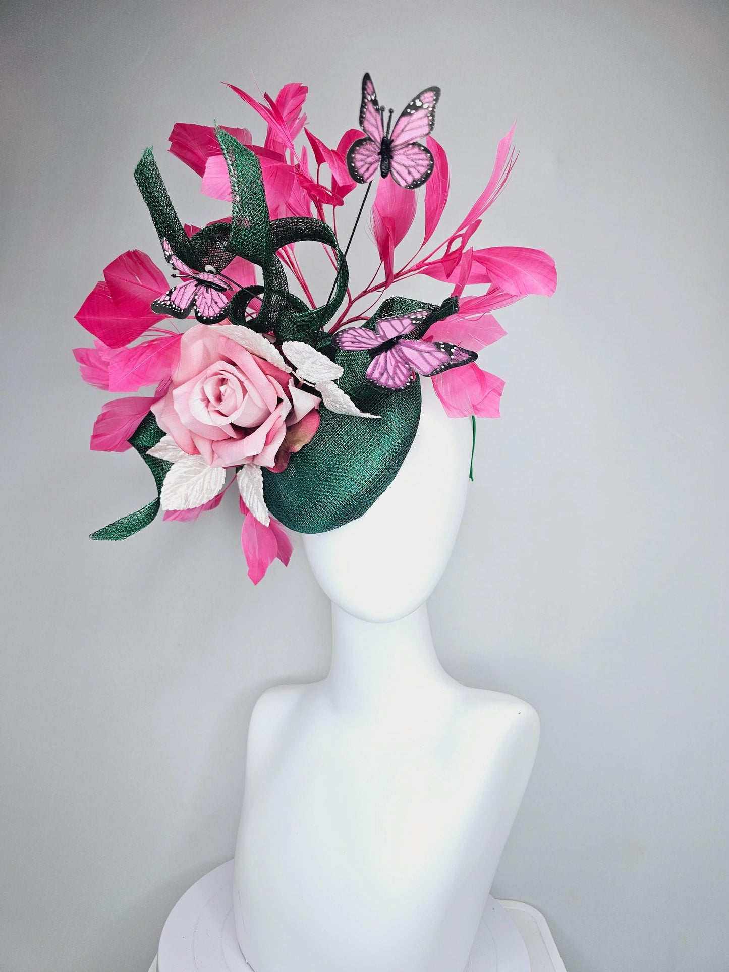 kentucky derby hat fascinator dark green sinamay w/ curls, pink ombre satin rose,white leaves,pink branching feathers,pink black butterflies