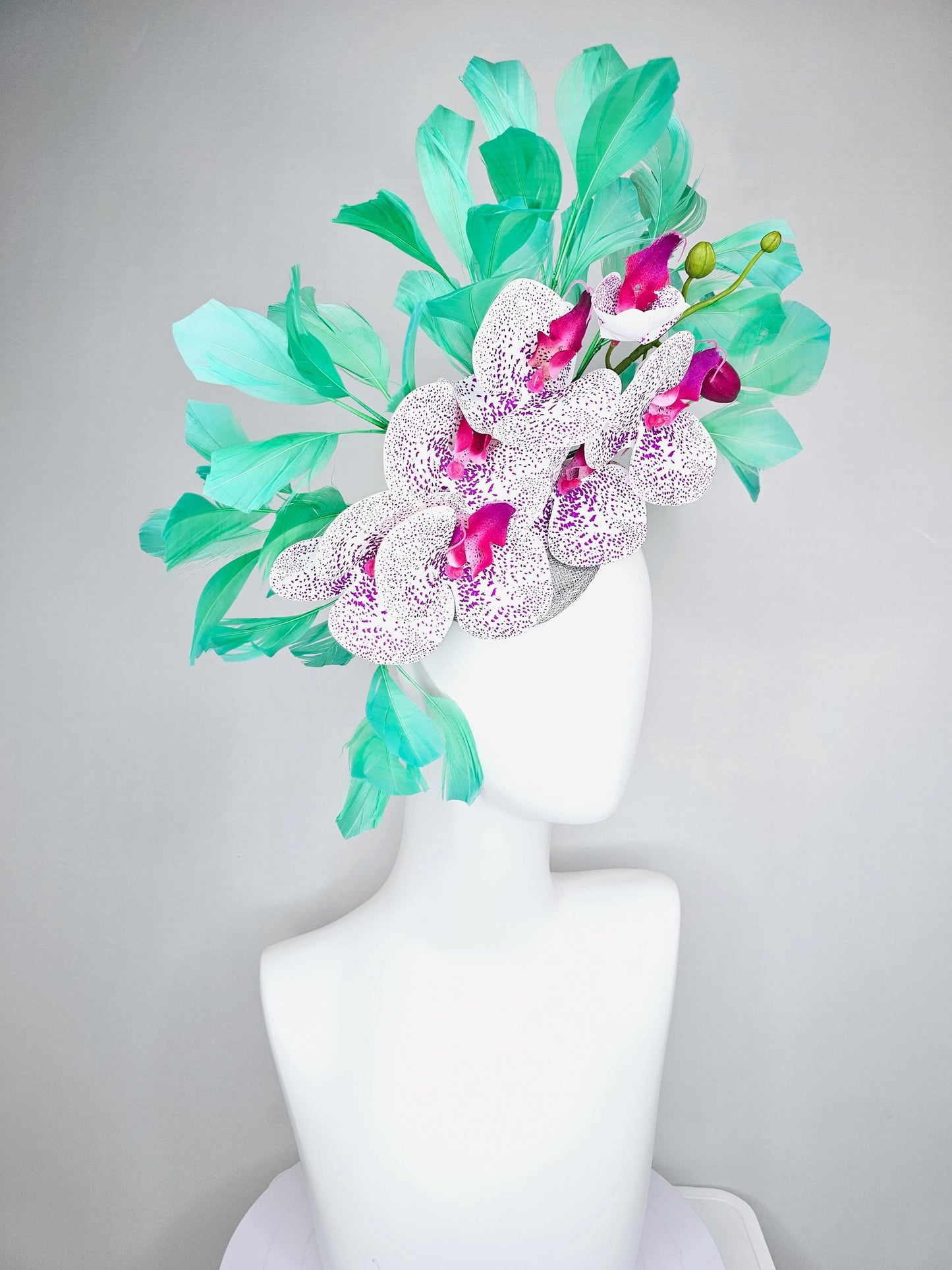 kentucky derby hat fascinator large white and purple satin silk orchid flowers, bright mint green branching feathers