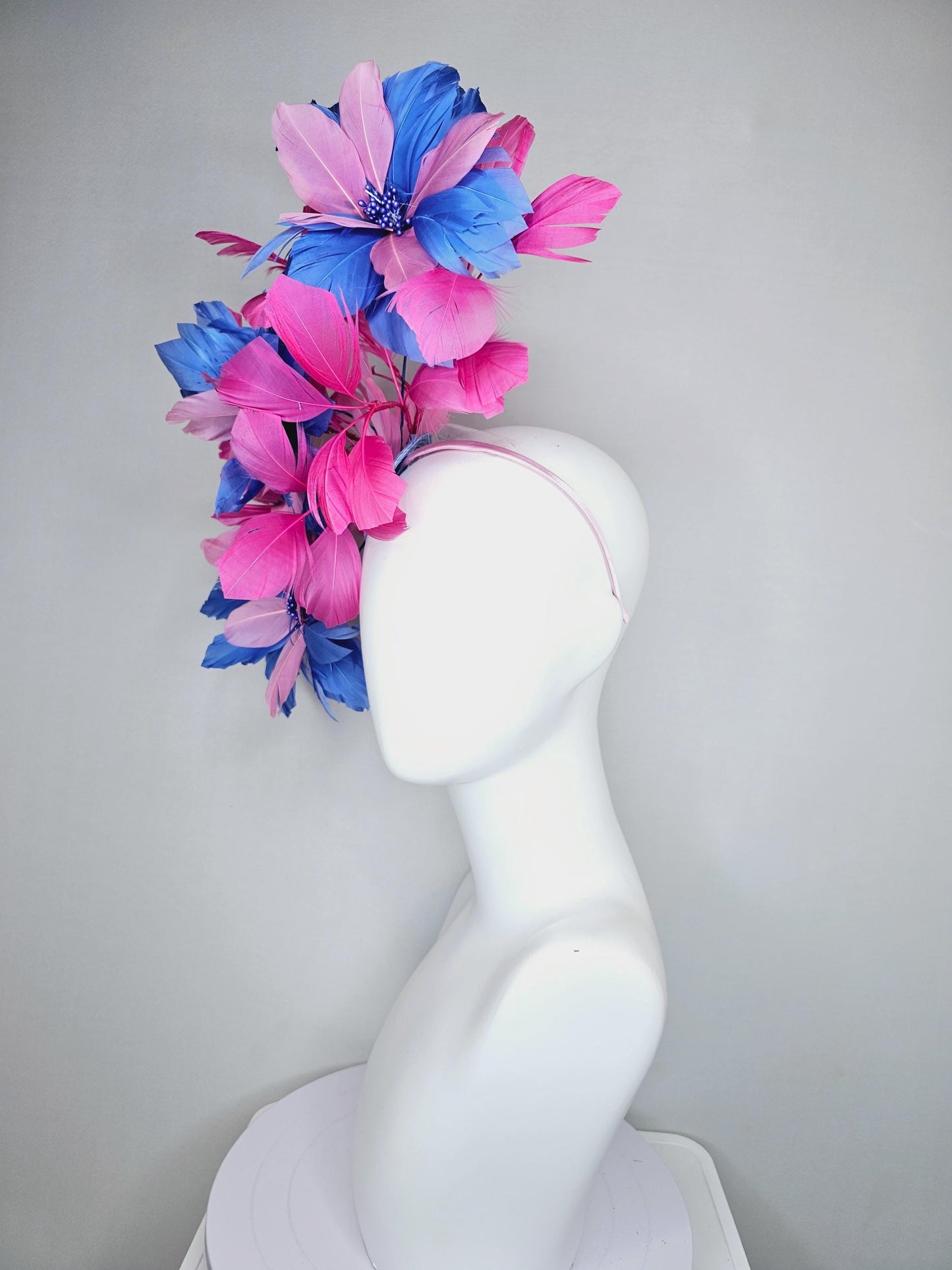 kentucky derby hat fascinator with large cobalt royal blue light pink feather flowers and pink branching feathers