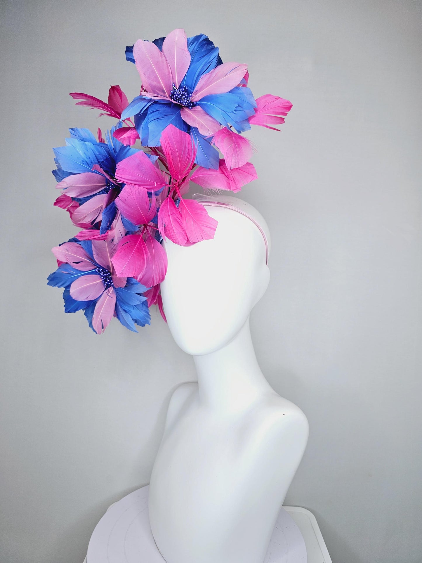 kentucky derby hat fascinator with large cobalt royal blue light pink feather flowers and pink branching feathers