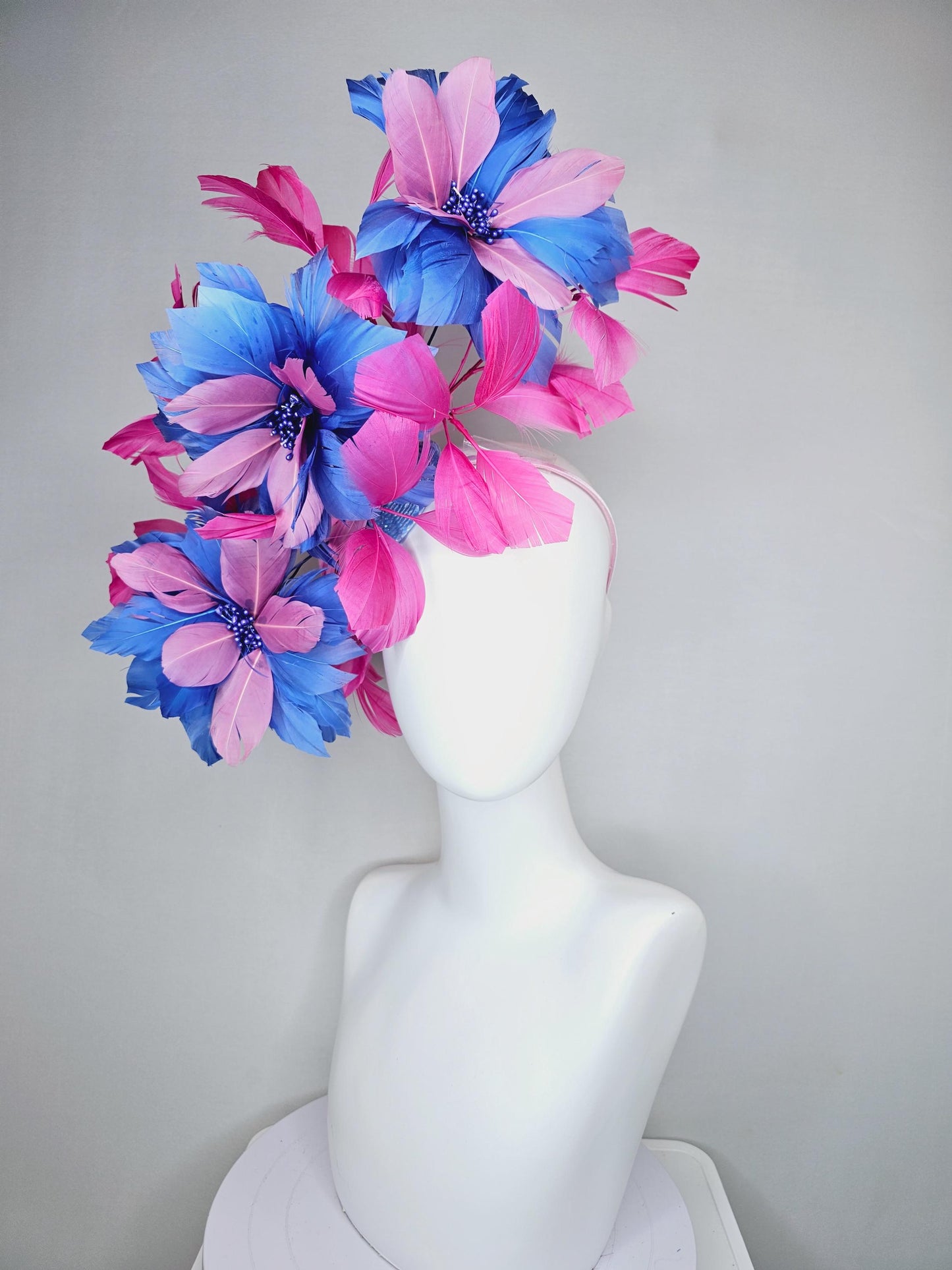 kentucky derby hat fascinator with large cobalt royal blue light pink feather flowers and pink branching feathers