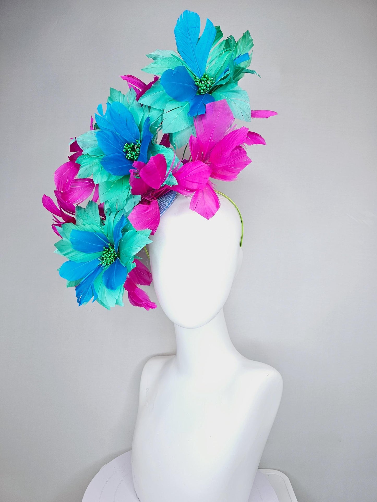 kentucky derby hat fascinator with large mint green sky blue feather flowers and bright fuchsia pink branching feathers