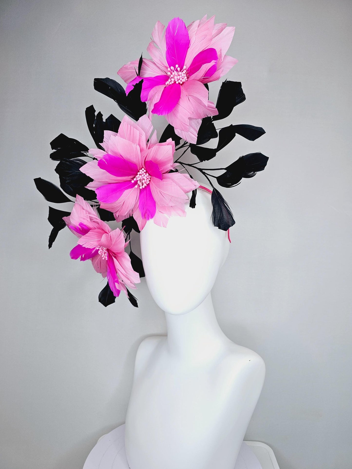 kentucky derby hat fascinator with large light pink bright fuchsia pink feather flowers and black branching feathers