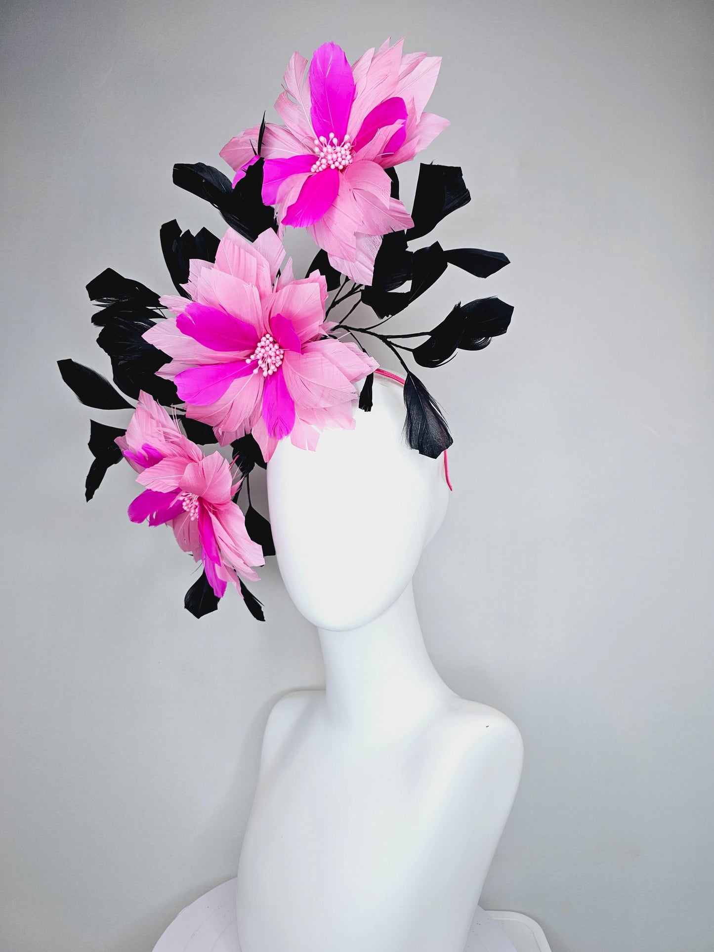 kentucky derby hat fascinator with large light pink bright fuchsia pink feather flowers and black branching feathers