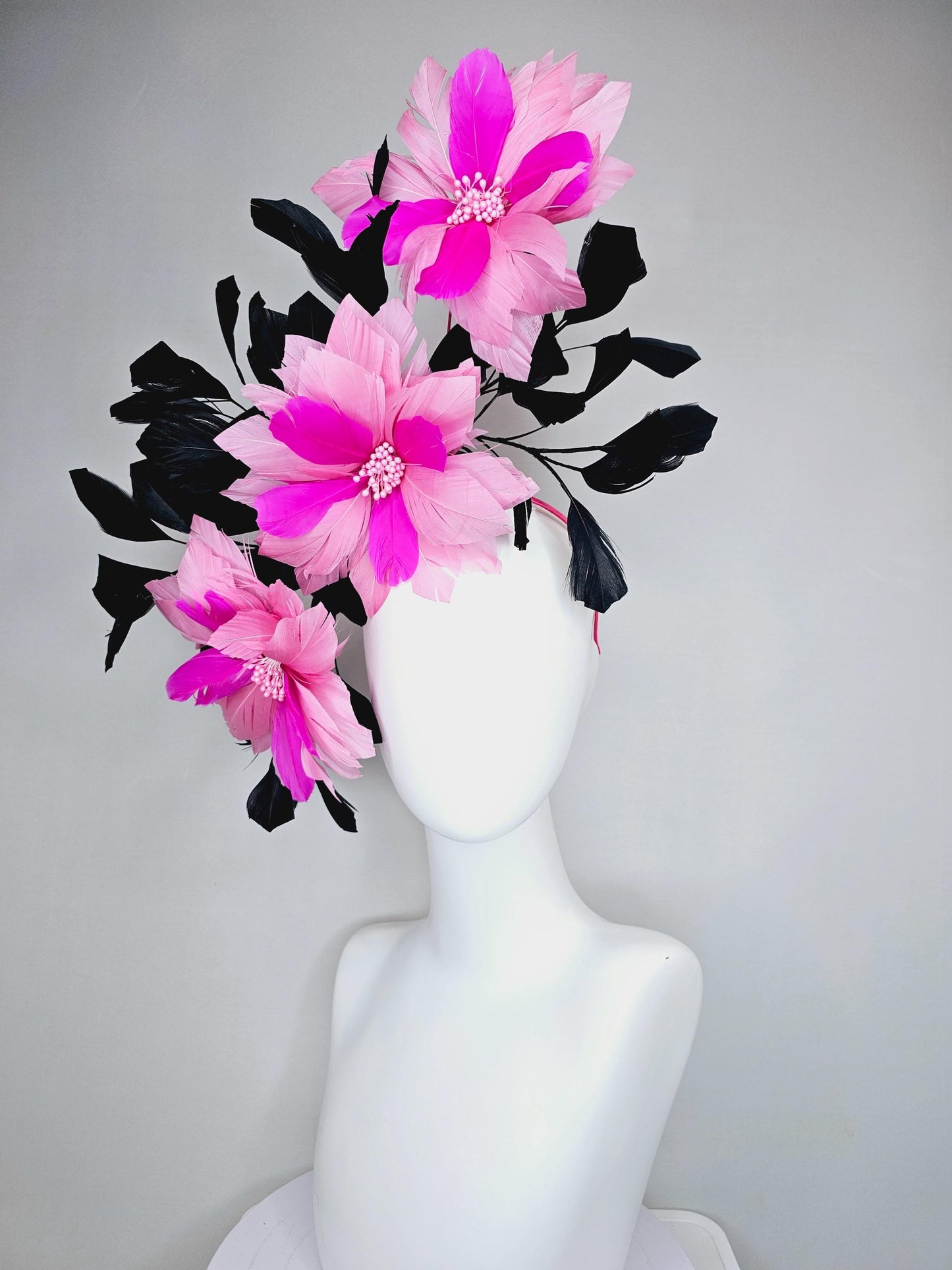 kentucky derby hat fascinator with large light pink bright fuchsia pink feather flowers and black branching feathers