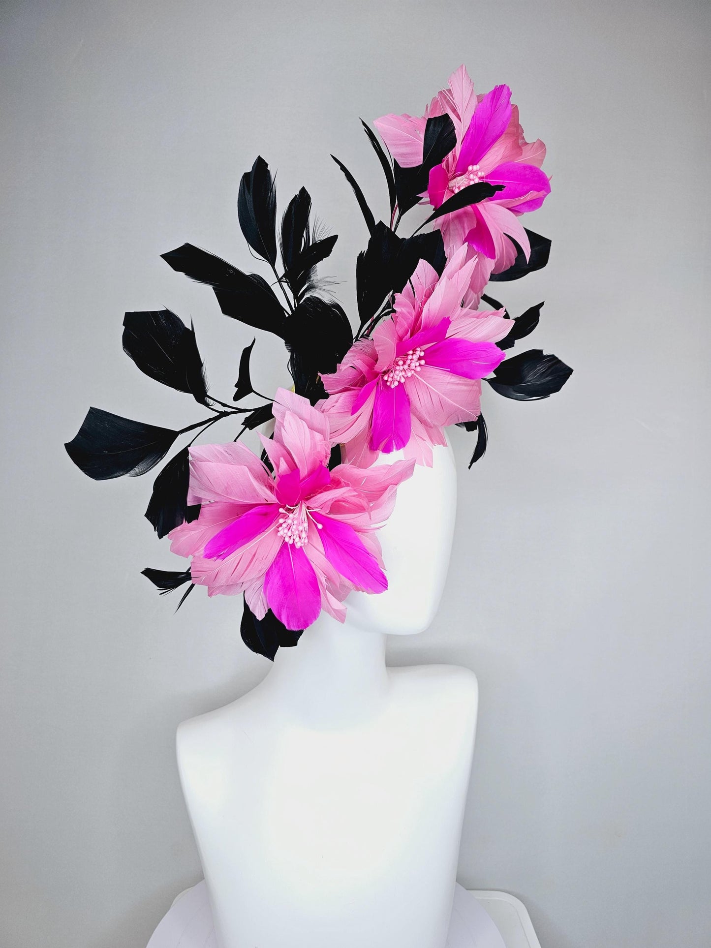 kentucky derby hat fascinator with large light pink bright fuchsia pink feather flowers and black branching feathers