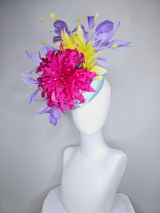 kentucky derby hat fascinator light blue satin with netting, bright pink curly feather flower, yellow and lavender purple branching feathers