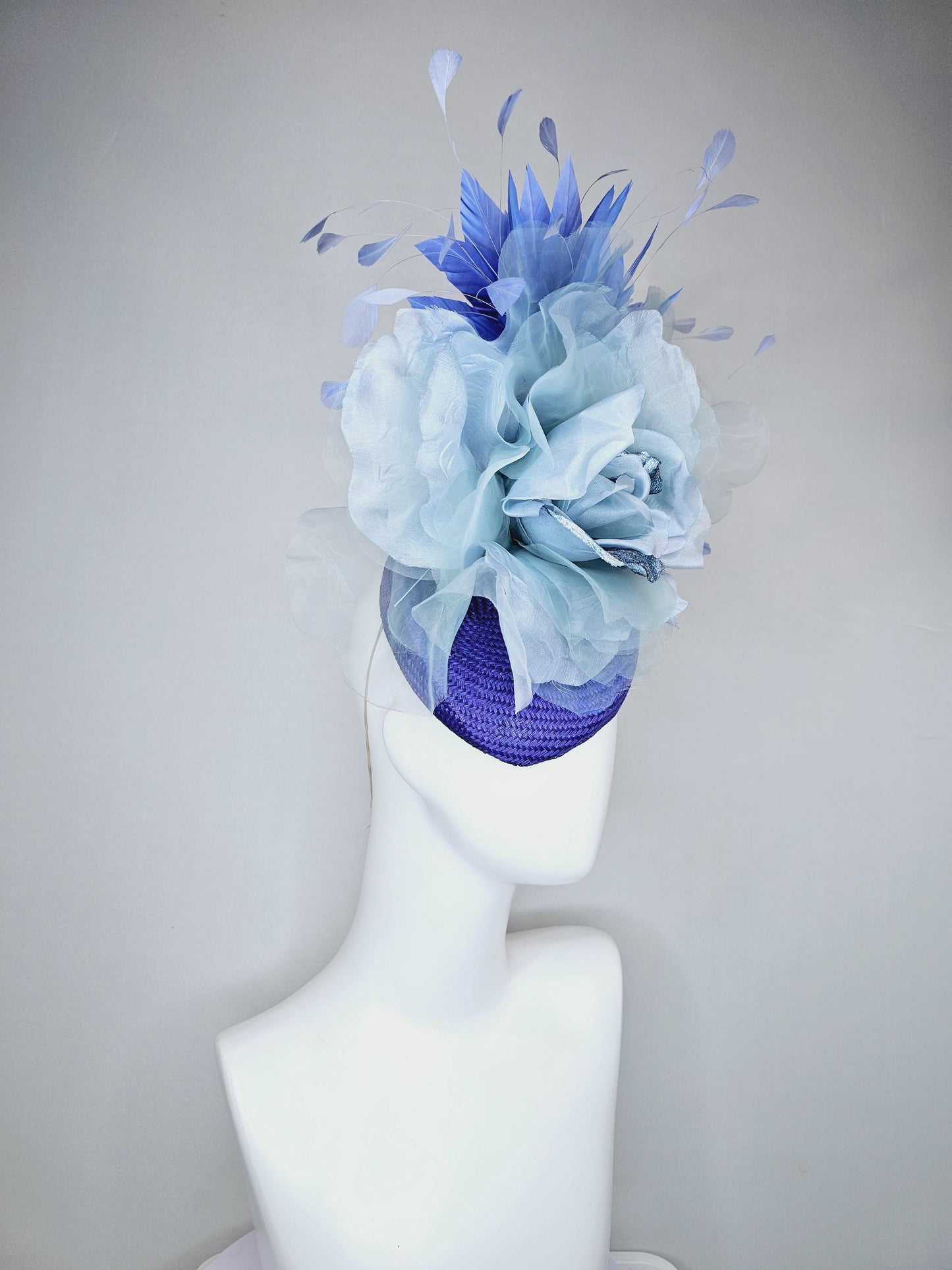 kentucky derby hat fascinator royal blue woven base with large light blue organza satin rose flower and light cobalt blue branching feathers