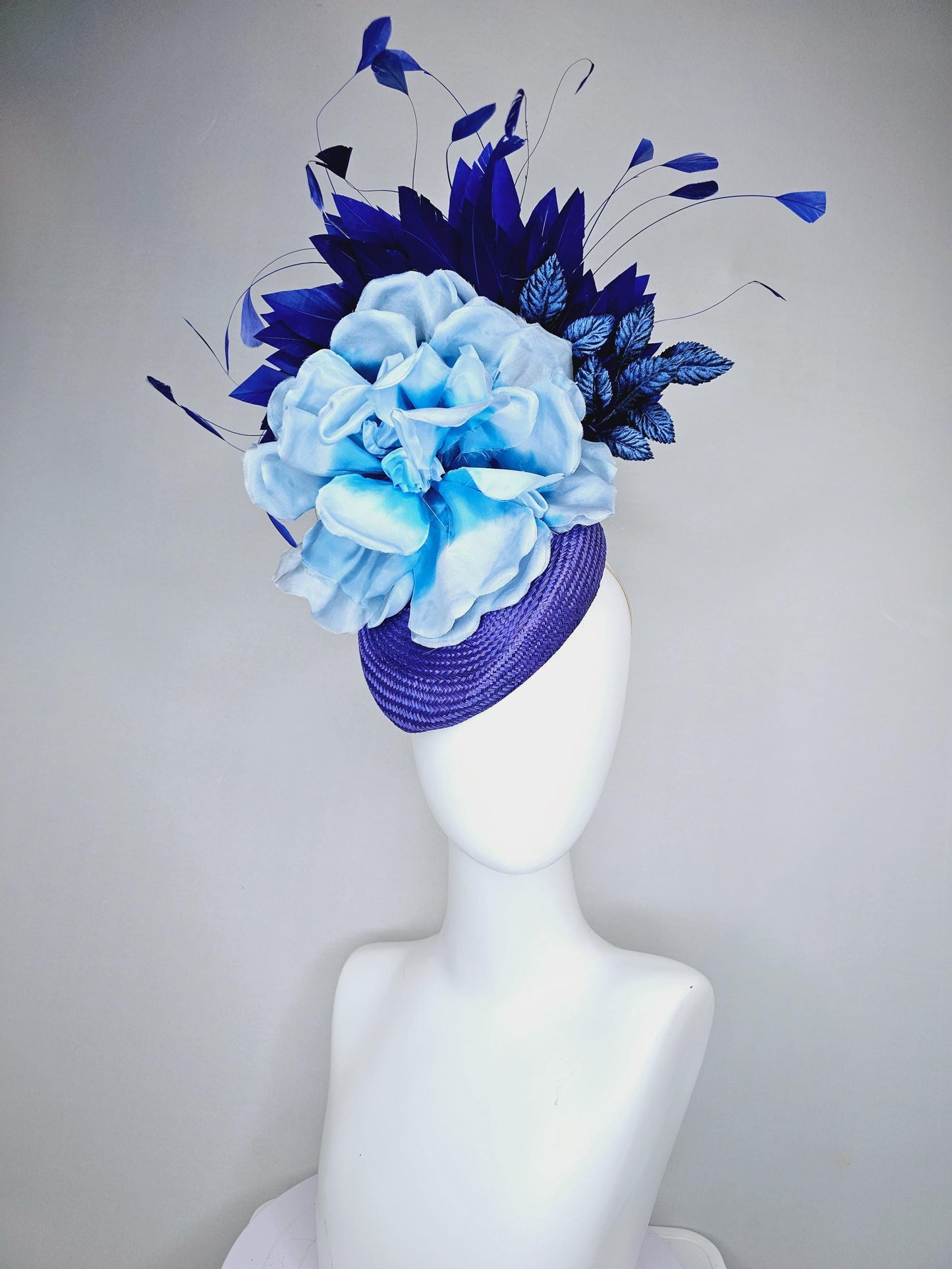 kentucky derby hat fascinator royal blue woven base with large light blue satin silk rose flower and midnight navy blue branching feathers