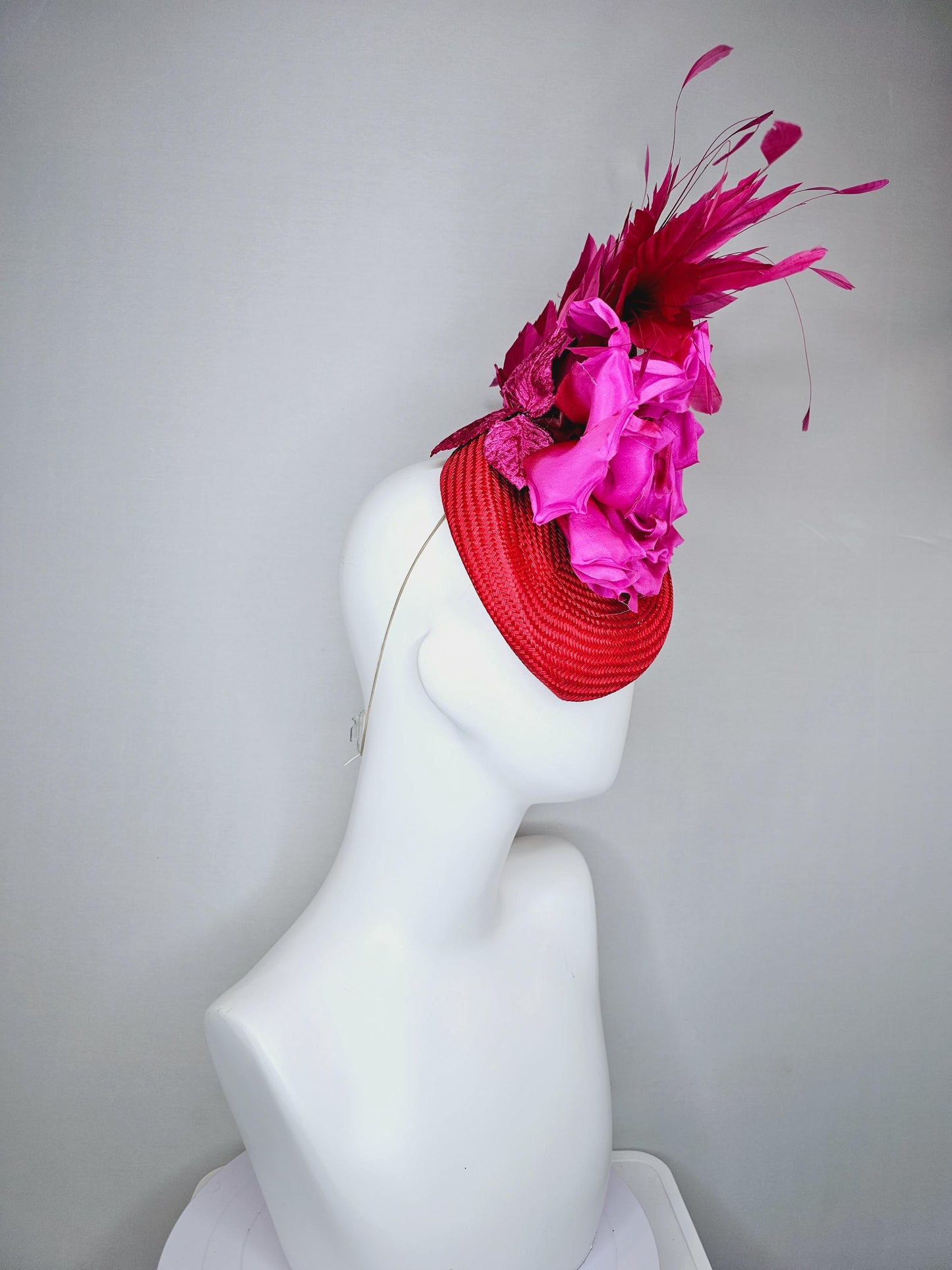 kentucky derby hat fascinator bright red woven base with large fuchsia pink satin silk rose flower and hot pink branching feathers