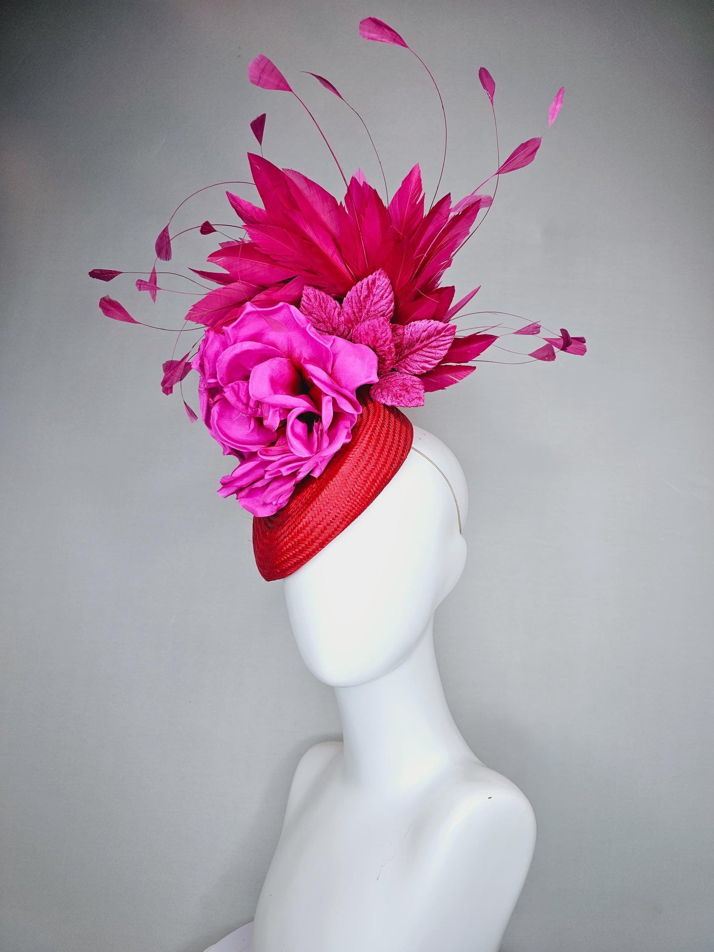 kentucky derby hat fascinator bright red woven base with large fuchsia pink satin silk rose flower and hot pink branching feathers