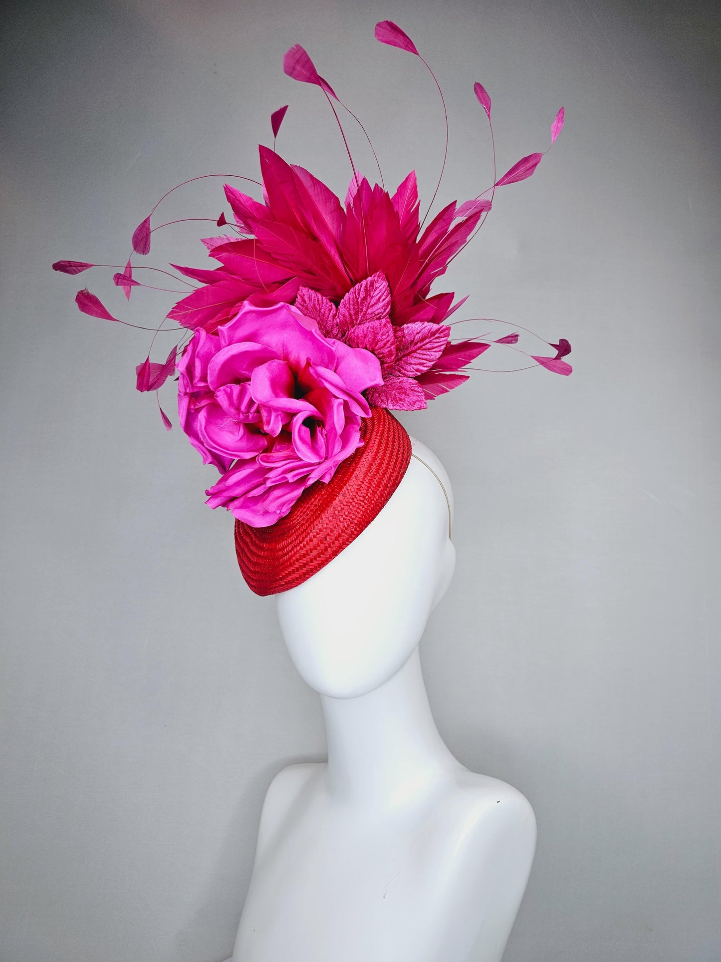 kentucky derby hat fascinator bright red woven base with large fuchsia pink satin silk rose flower and hot pink branching feathers