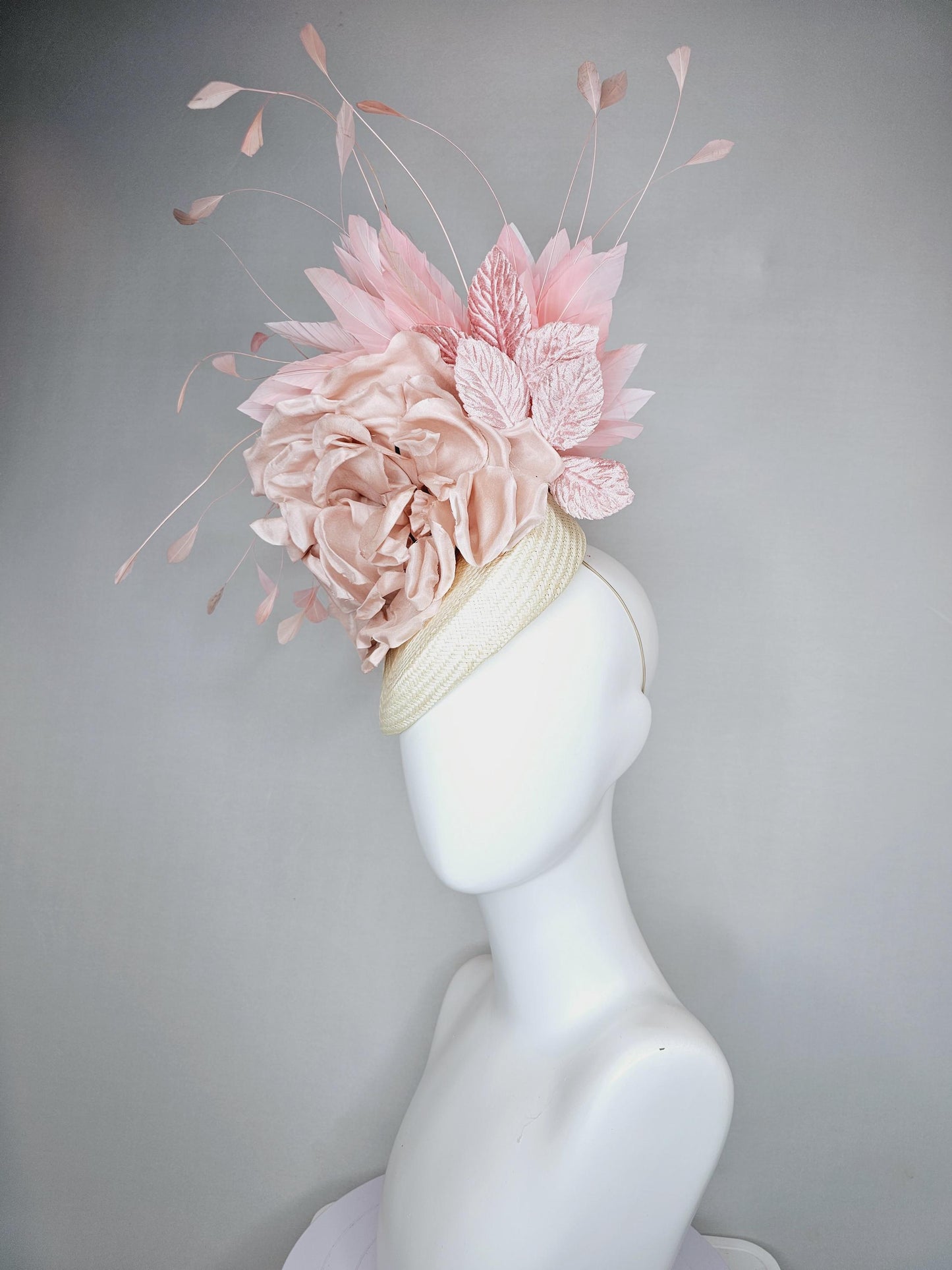 kentucky derby hat fascinator ivory white woven base,dusty pink satin silk rose flower,light pink branching feathers and light pink leaves